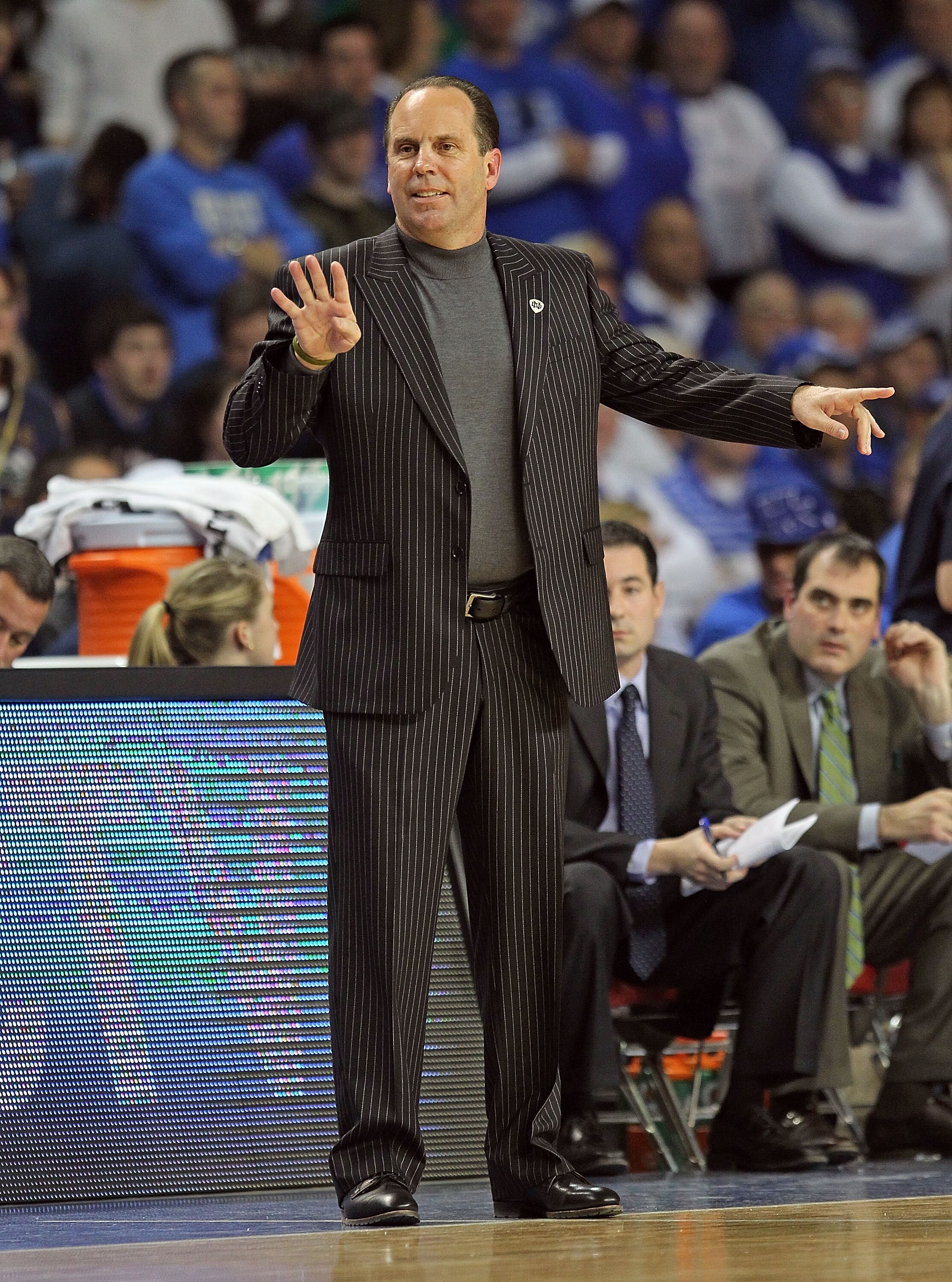 LOUISVILLE, KY - DECEMBER 08: Mike Brey the Head Coach of the Notre Dame Fighting Irish gives instructions to his team during the game against the Kentucky Wildcats in the 2010 DIRECTV SEC/BIG EAST Invitational at Freedom Hall on December 8, 2010 in Louis
