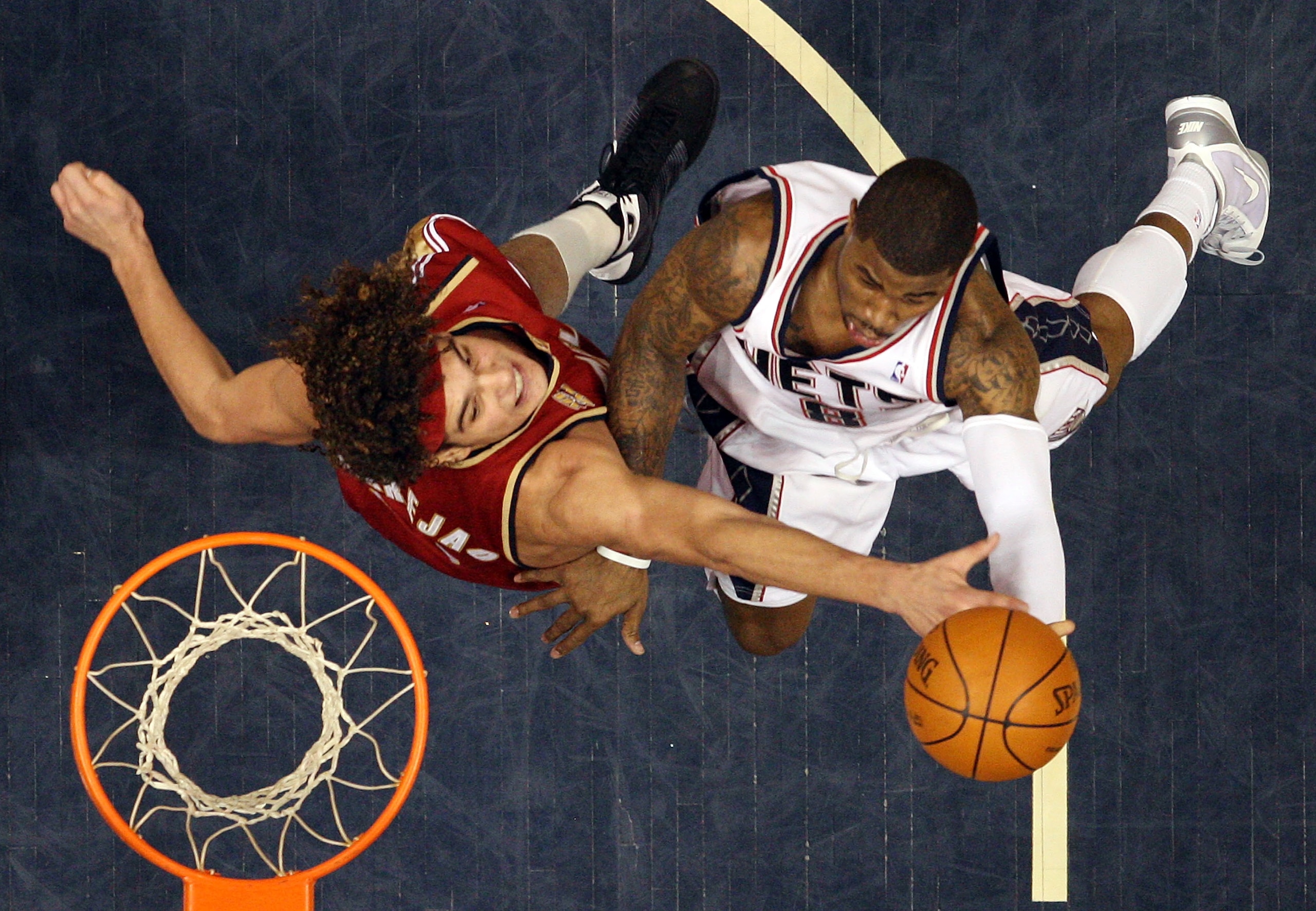 EAST RUTHERFORD, NJ - MARCH 03:  Terrence Williams #8 of the New Jersey Nets drives against Anderson Varejao #17 of the Cleveland Cavaliers at the Izod Center on March 3, 2010 in East Rutherford, New Jersey.NOTE TO USER: User expressly acknowledges and ag