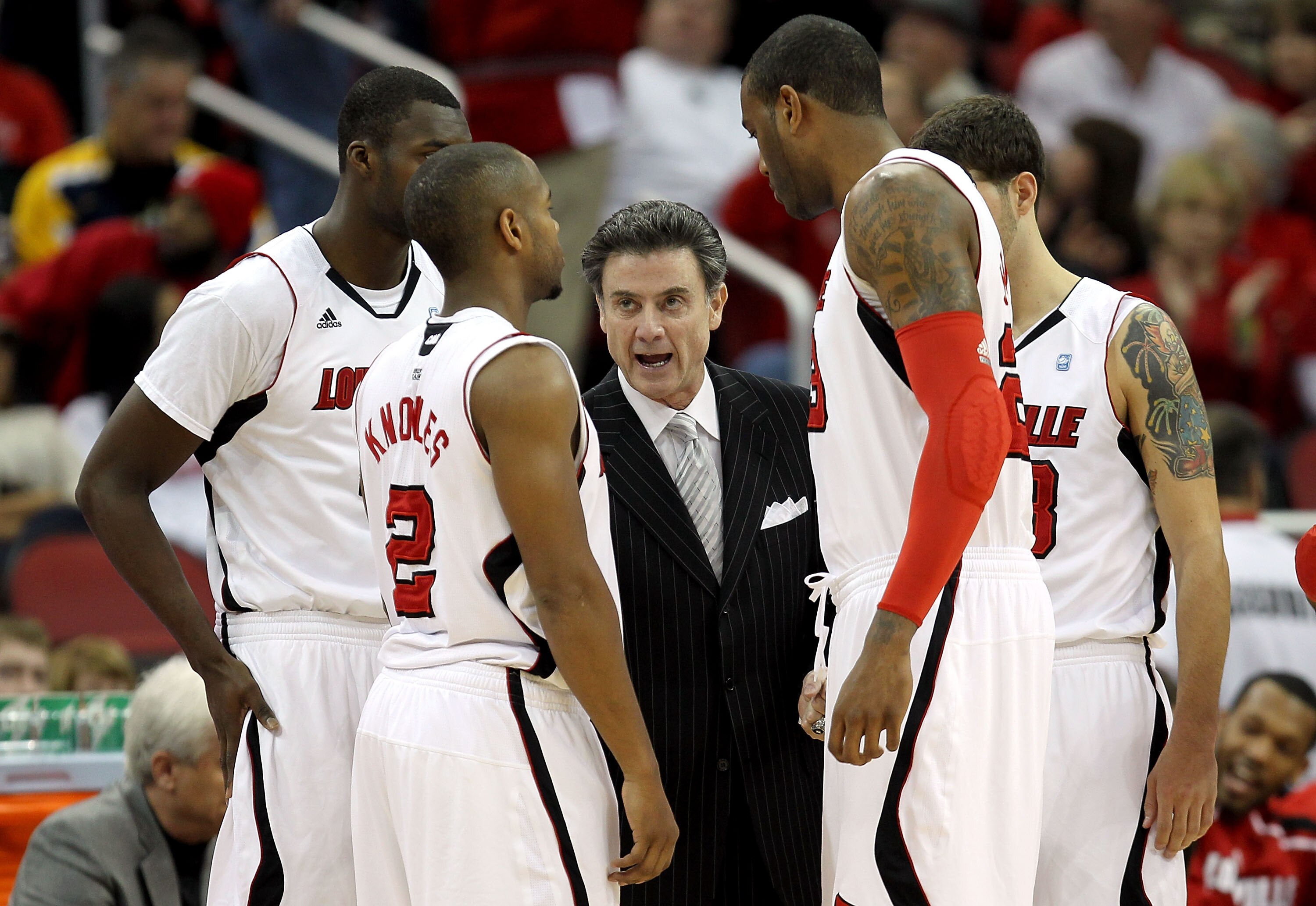 LOUISVILLE, KY - DECEMBER 11:  Rick Pitino the Head Coach of the Louisville Cardinals gives instructions to his team during the game against the UNLV Runnin' Rebels at KFC YUM! Center on December 11, 2010 in Louisville, Kentucky.  (Photo by Andy Lyons/Get
