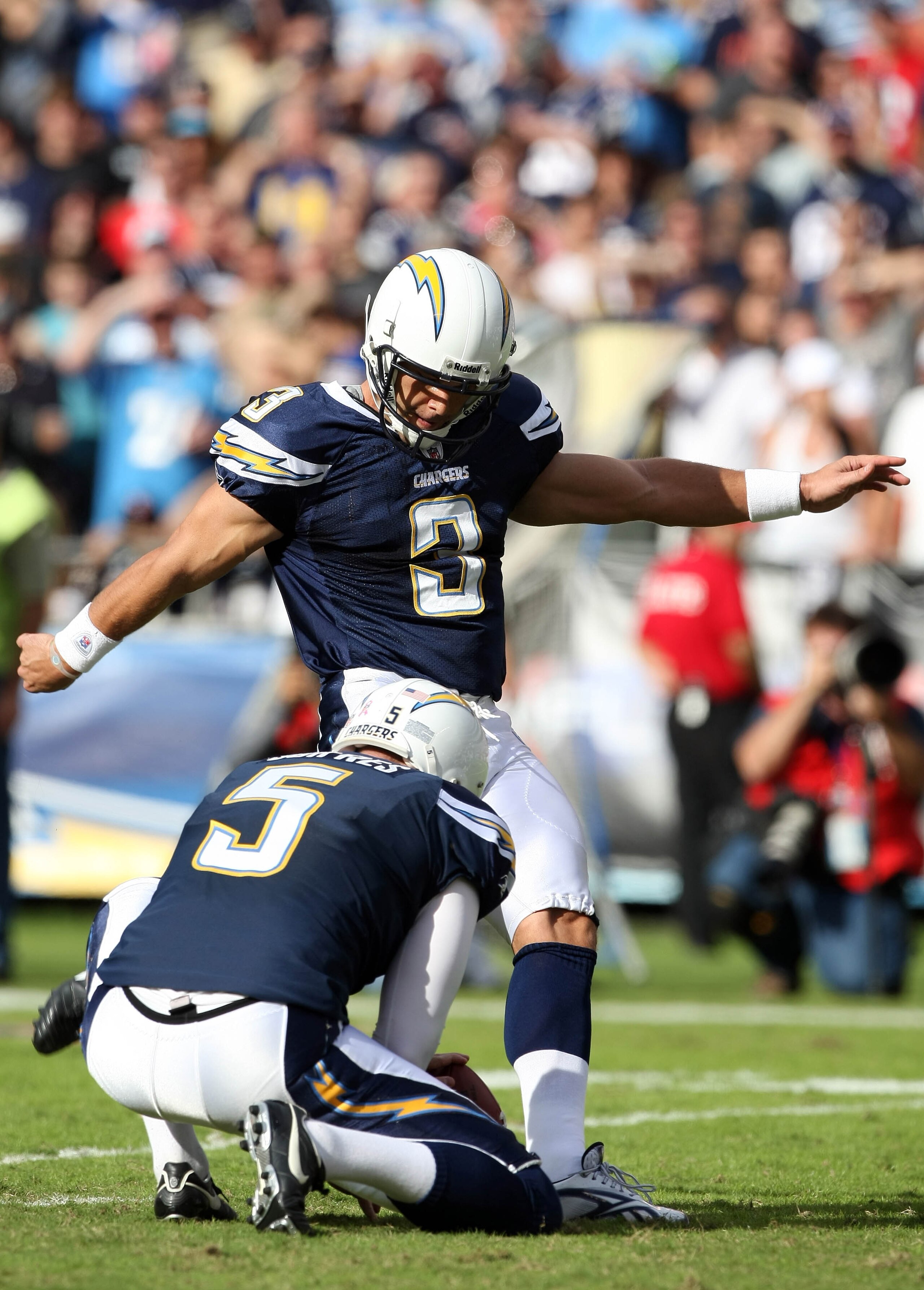 SAN DIEGO - OCTOBER 24:  Kicker Kris Brown #3 kicks a filed goal as teammate Mike Scifres #5 holds against the New England Patriots during NFL game on October 24, 2010 at Qualcomm Stadium in San Diego, California. (Photo by Donald Miralle/Getty Images)