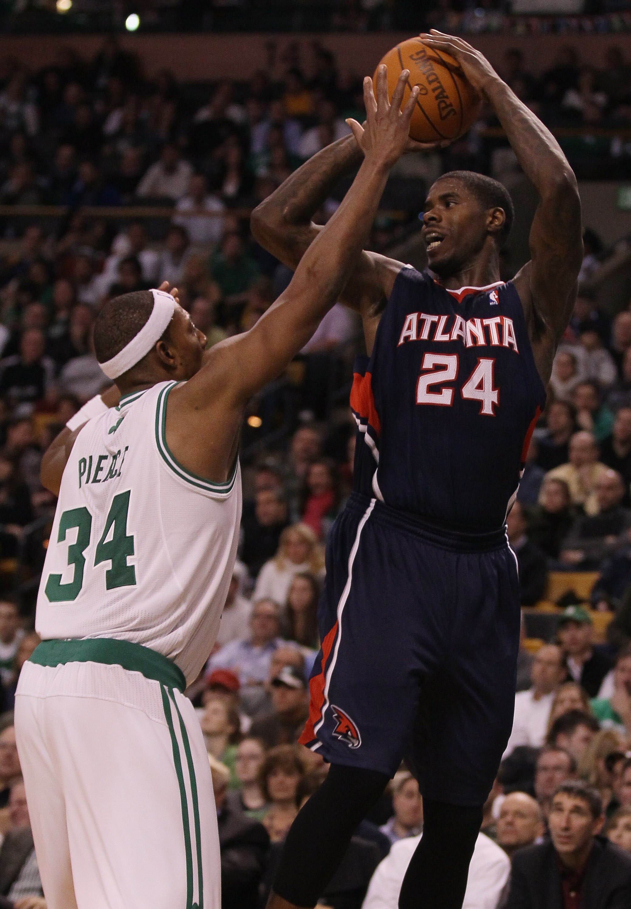 BOSTON, MA - DECEMBER 16:  Marvin Williams #24 of the Atlanta Hawks looks to pass as Paul Pierce #34 of the Boston Celtics defends on December 16, 2010 at the TD Garden in Boston, Massachusetts. The Celtics defeated the Hawks 102-90. NOTE TO USER: User ex