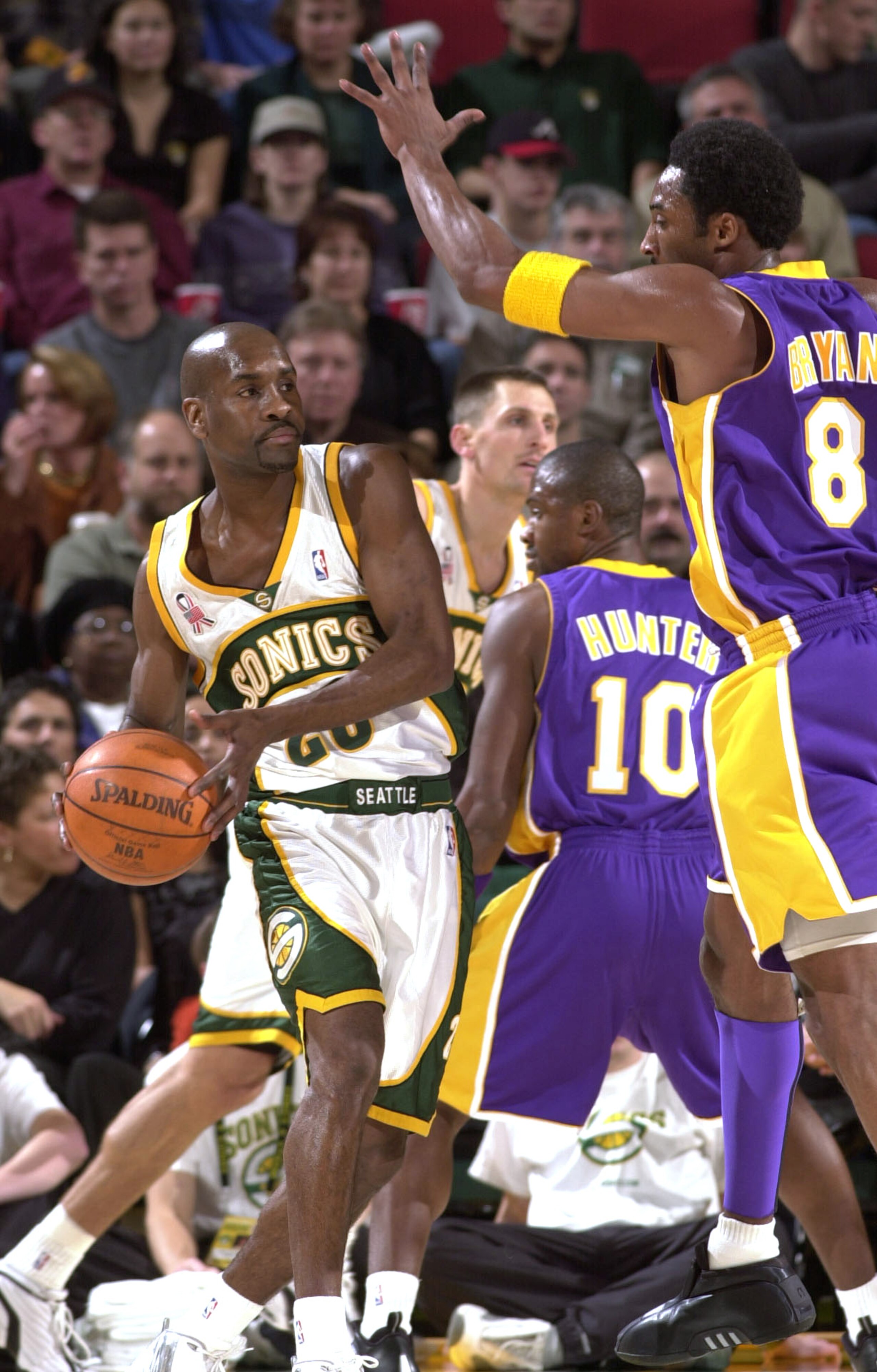 30 NOV 2001:  Gary Payton #20 of the Seattle SuperSonics looks to pass against Kobe Bryant #8 of the Los Angeles Lakers  during first half action at Key Arena in Seattle Washington.  The Lakers defeated the Sonics 107-92. DIGITAL IMAGE  NOTE TO USER: User