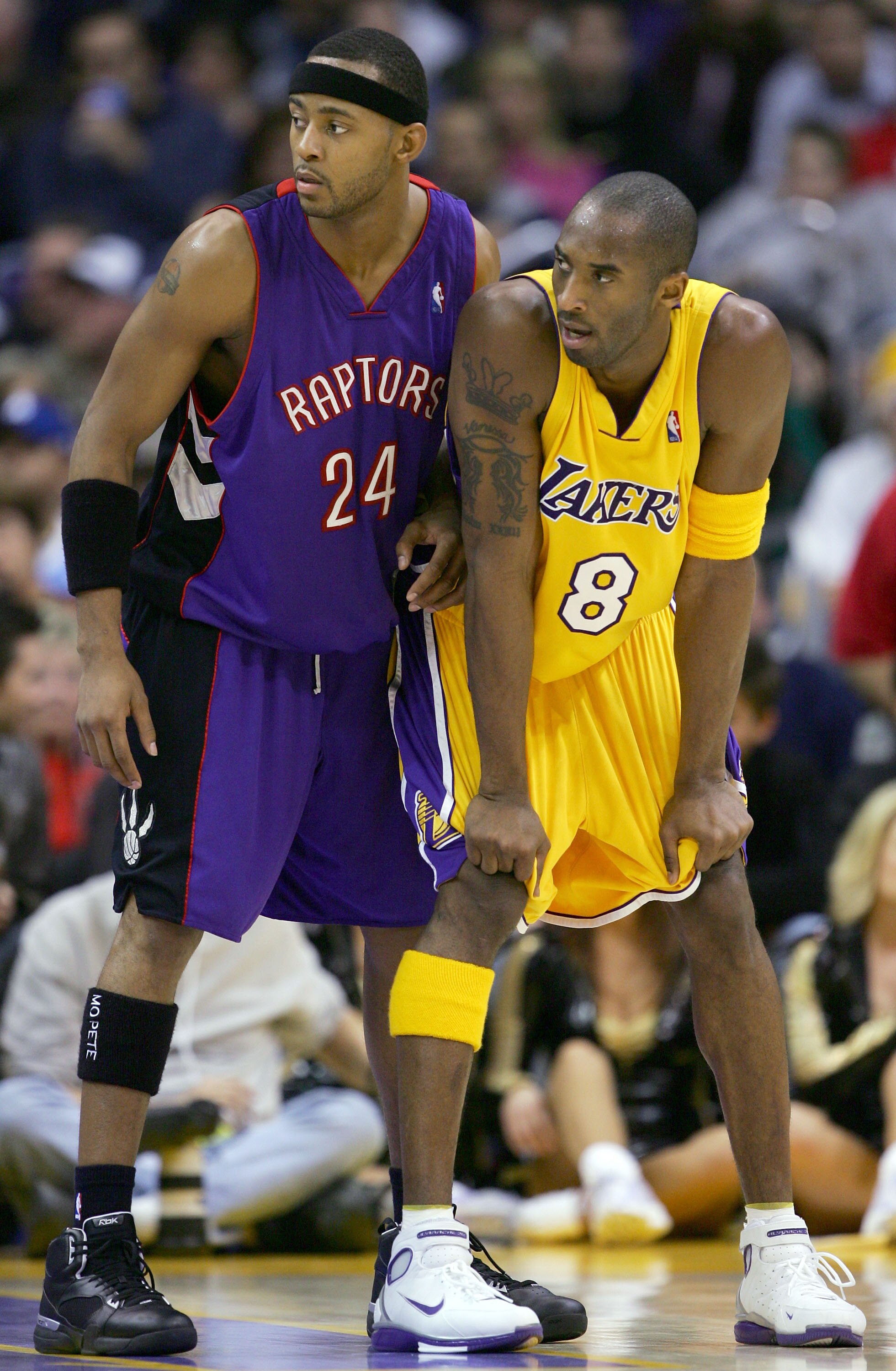 LOS ANGELES - DECEMBER 28:  Morris Peterson #24 of the Toronto Raptors lines up with Kobe Bryant #8 of the Los Angeles Lakers during the game on December 28, 2004 at Staples Center in Los Angeles, California.  The Lakers defeated the Raptors 117-99.  NOTE
