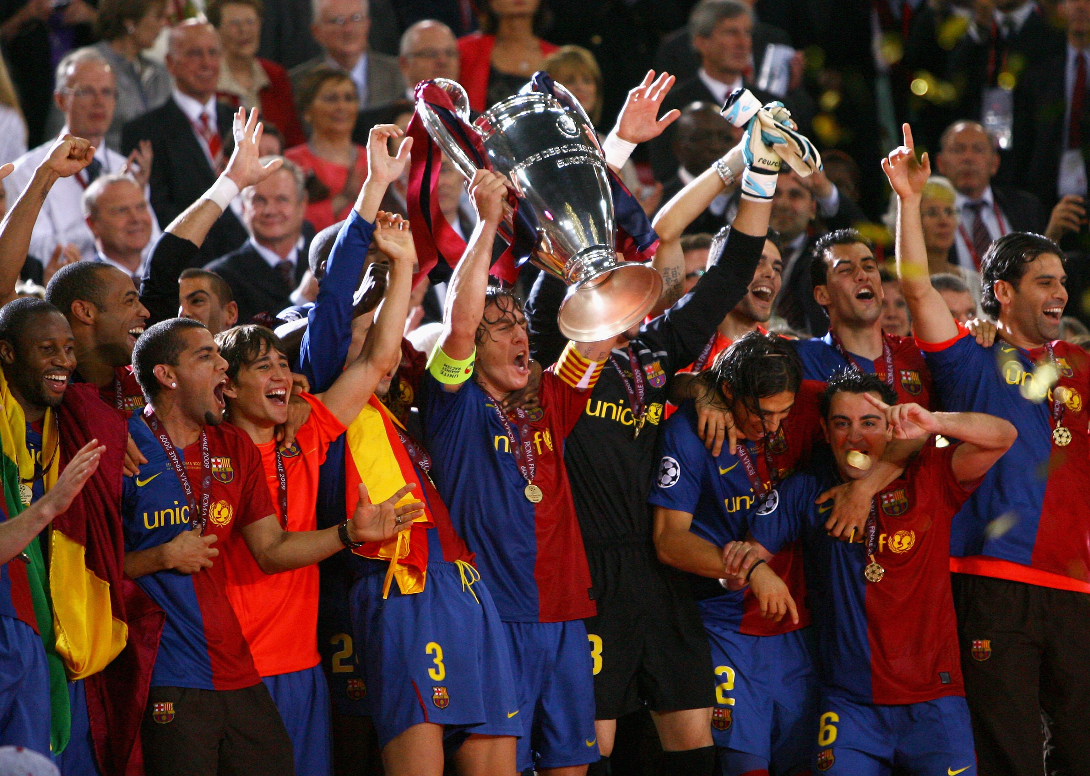 ROME - MAY 27:  Carles Puyol of Barcelona lifts the trophy as he and his team mates celebrates winning the UEFA Champions League Final match between Barcelona and Manchester United at the Stadio Olimpico on May 27, 2009 in Rome, Italy. Barcelona won 2-0.