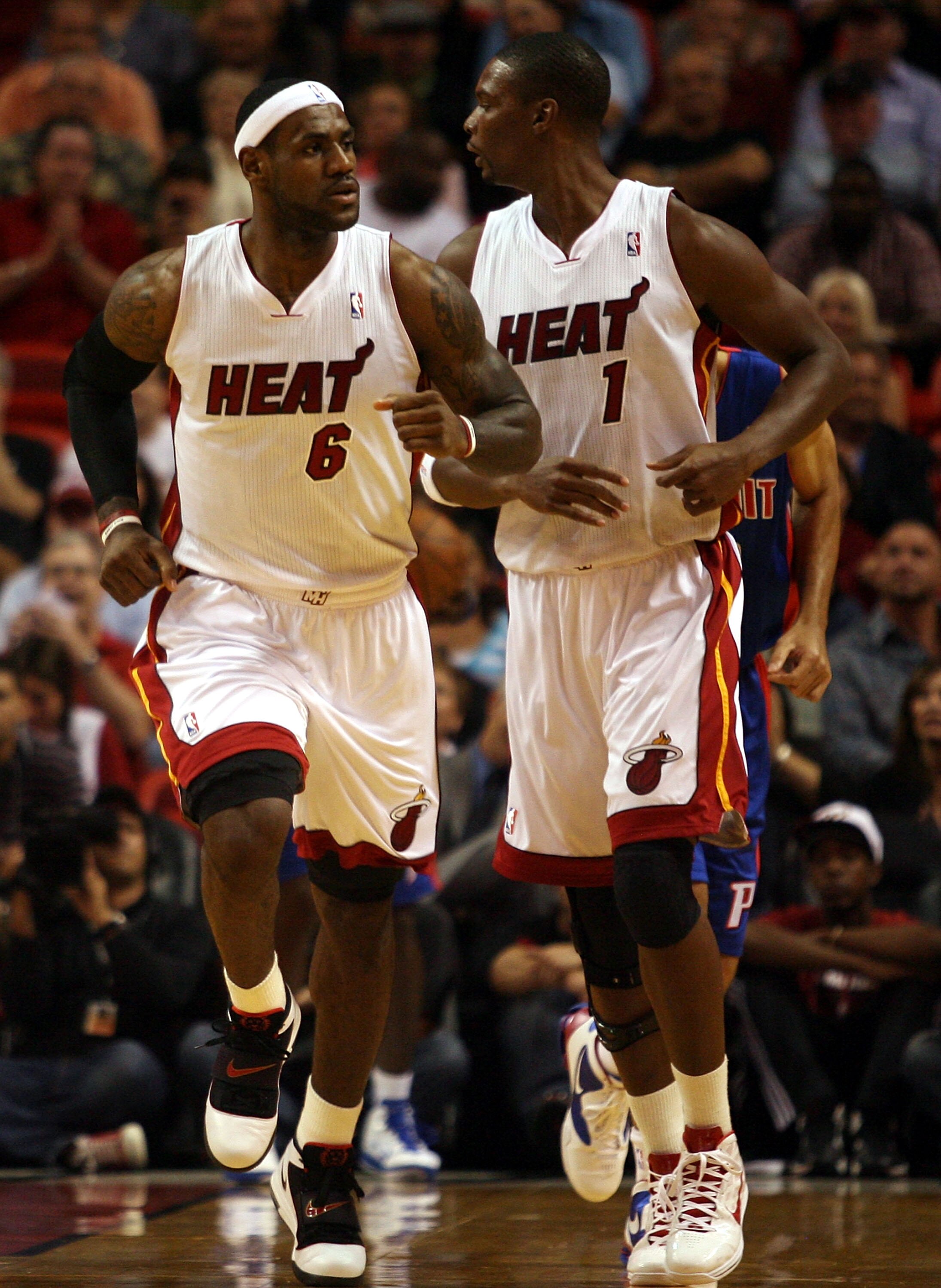 MIAMI - OCTOBER 05:  Center Chris Bosh #1 of the Miami Heat (R) and teammate LeBron James #6 against the Detroit Pistons on October 5, 2010 in Miami, Florida.  NOTE TO USER: User expressly acknowledges and agrees that, by downloading and or using this pho