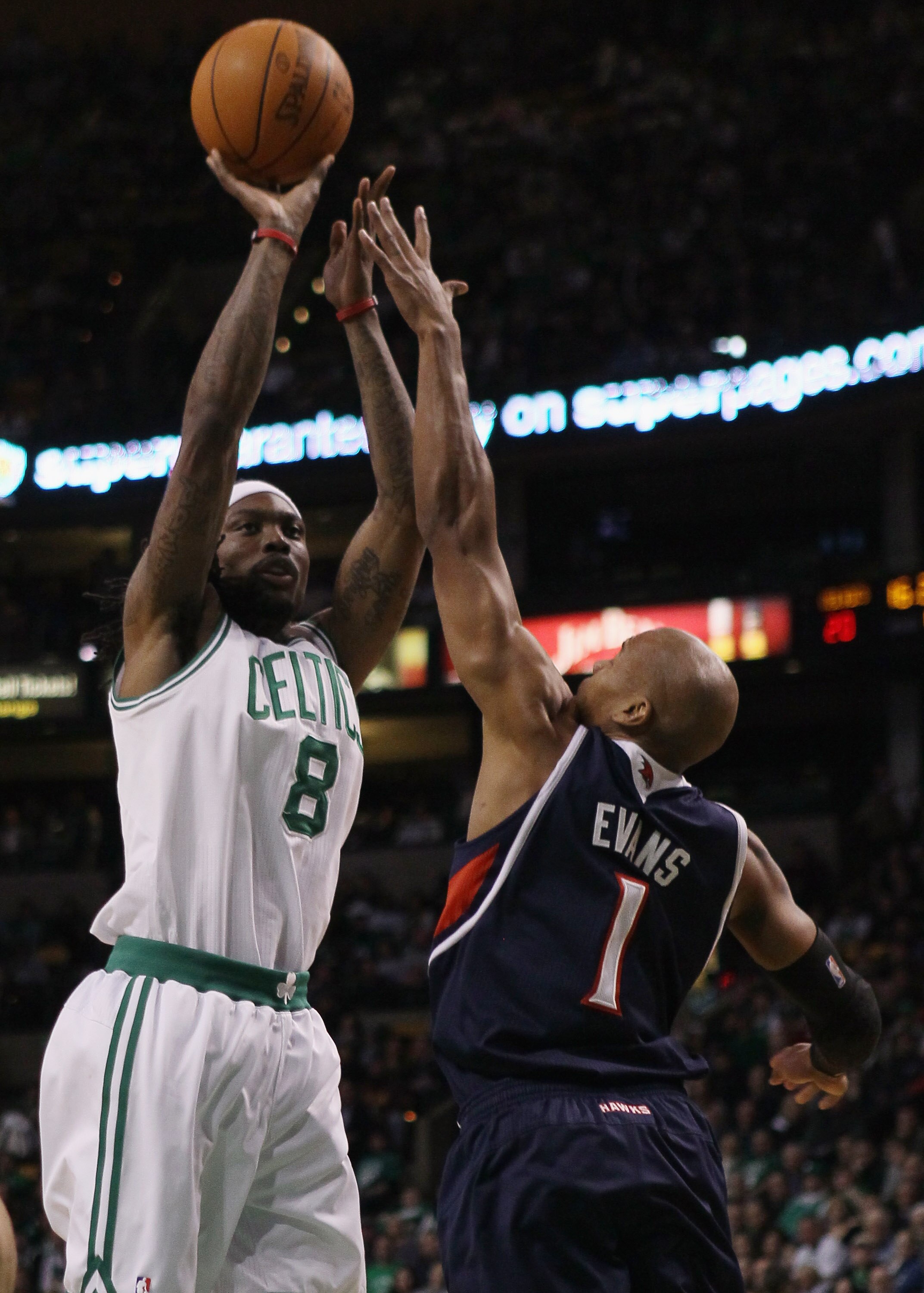 BOSTON, MA - DECEMBER 16:  Marquis Daniels #8 of the Boston Celtics takes a shot as Maurice Evans #1 of the Atlanta Hawks defends on December 16, 2010 at the TD Garden in Boston, Massachusetts. NOTE TO USER: User expressly acknowledges and agrees that, by