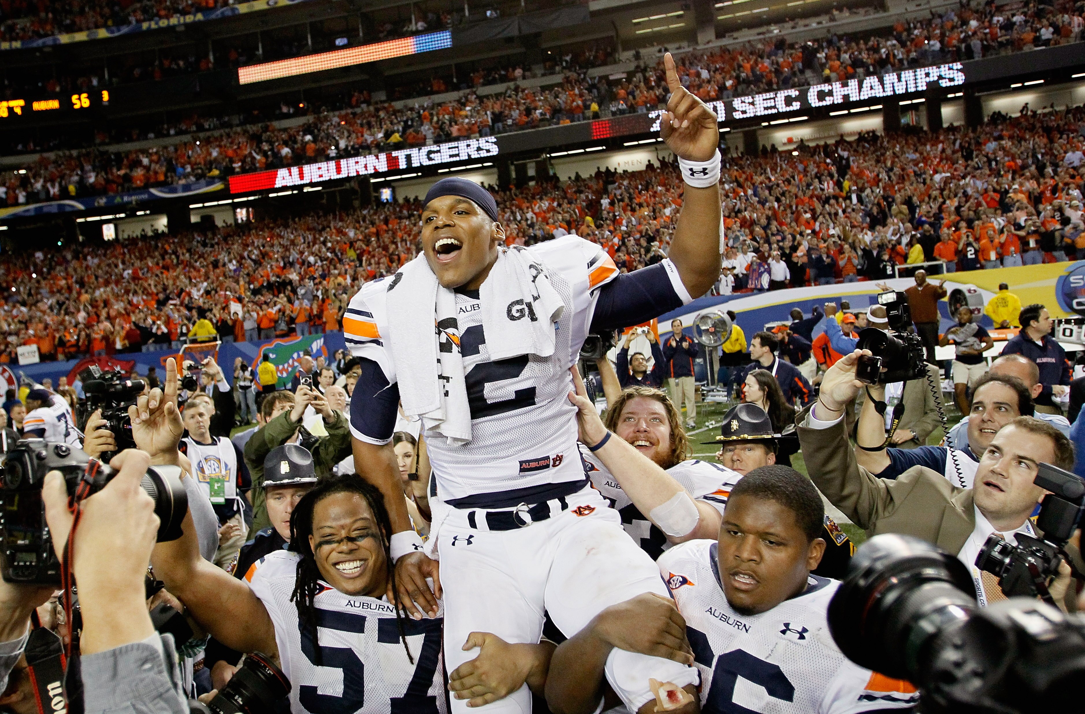 ATLANTA, GA - DECEMBER 04:  Quarterback Cam Newton #2 of the Auburn Tigers celebrates after their 56-17 win over the South Carolina Gamecocks during the 2010 SEC Championship at Georgia Dome on December 4, 2010 in Atlanta, Georgia.  (Photo by Kevin C. Cox