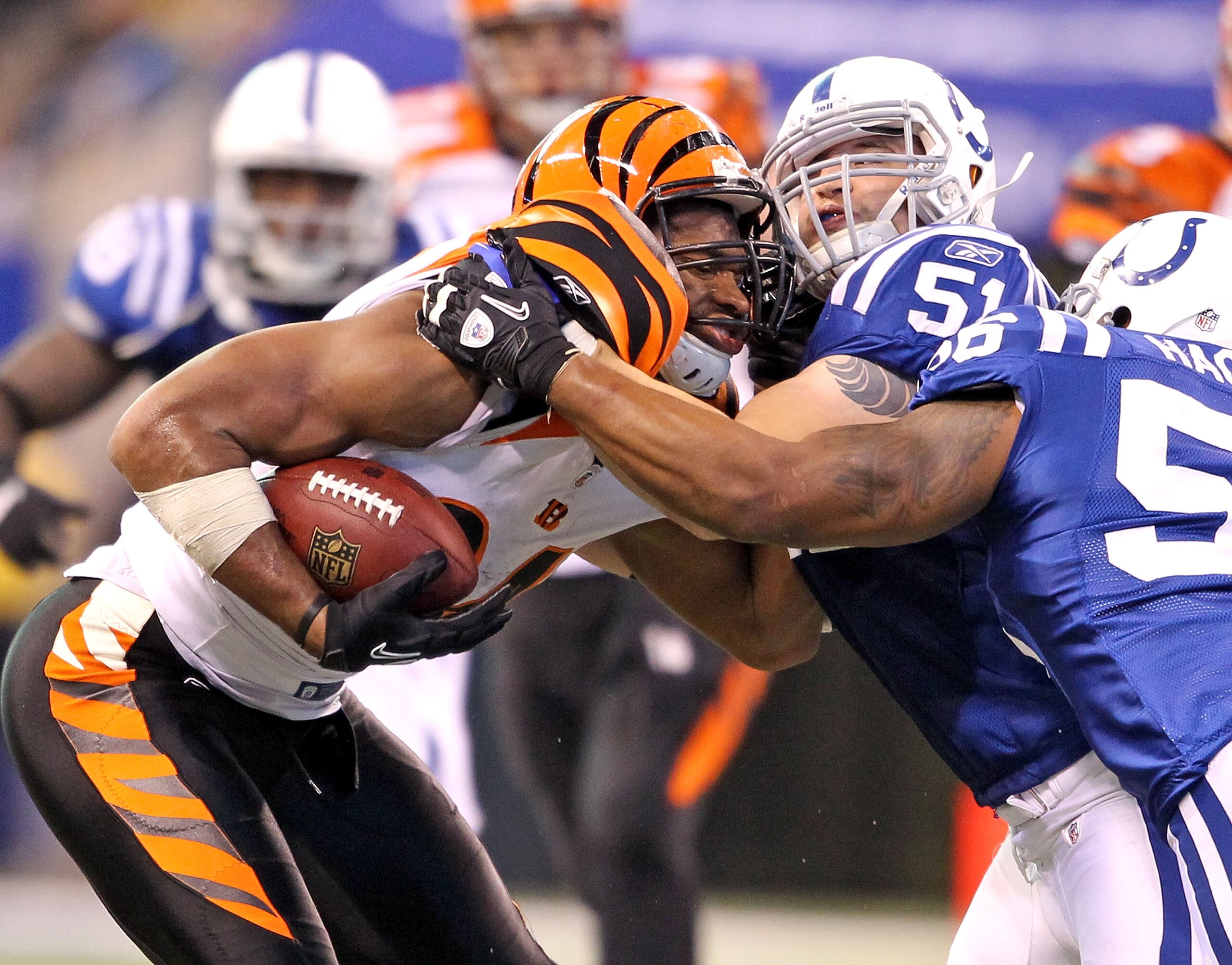 INDIANAPOLIS - NOVEMBER 14:  Jermaine Gresham #84 of the Cincinnati Bengals runs with the ball after catching and is tackled by Pat Angerer #51 of the Indianapolis Colts in the NFL game at Lucas Oil Stadium on November 14, 2010 in Indianapolis, Indiana.