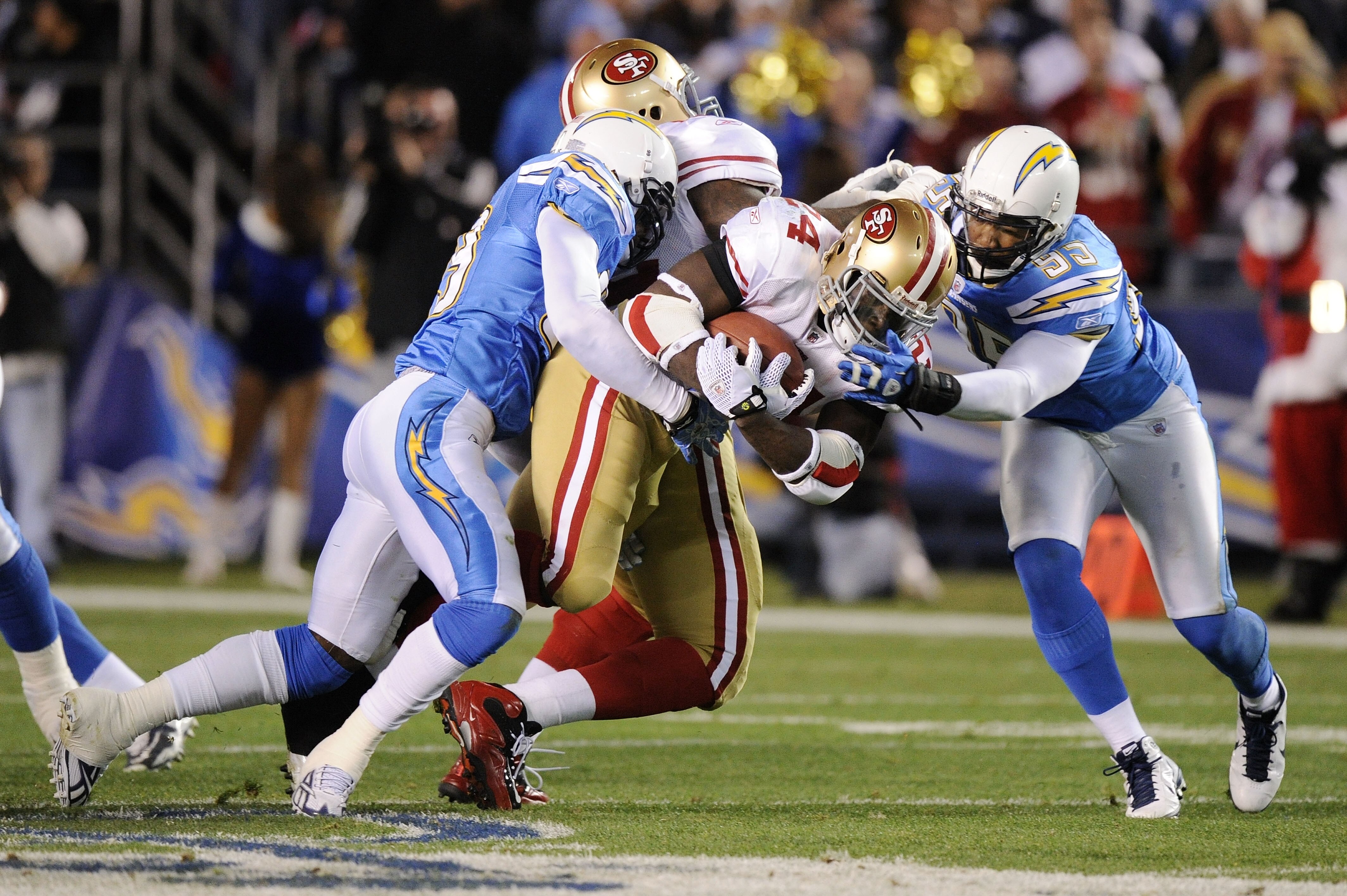 SAN DIEGO, CA - DECEMBER 16:  Running back Anthony Dixon #24 of the San Francisco 49ers rushes with the ball against the San Diego Chargers at Qualcomm Stadium on December 16, 2010 in San Diego, California.  (Photo by Harry How/Getty Images)