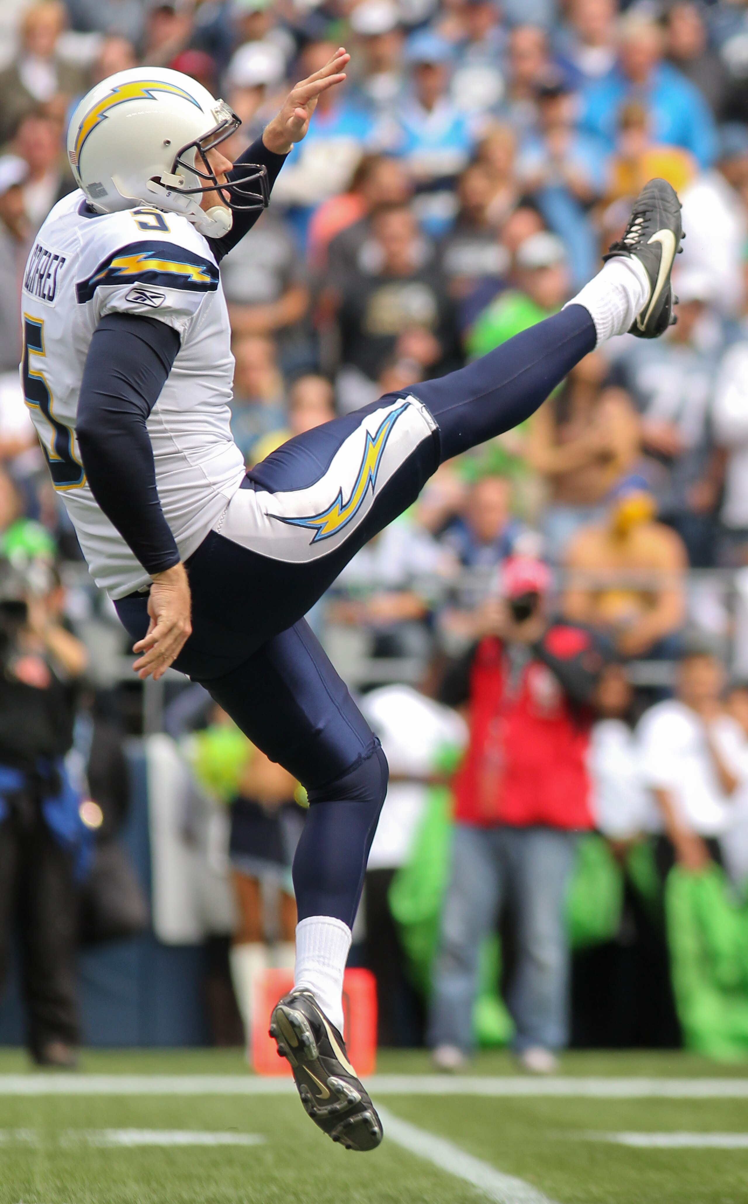 SEATTLE - SEPTEMBER 26:  Punter Mike Scifres #5 of the San Diego Chargers punts against the Seattle Seahawks at Qwest Field on September 26, 2010 in Seattle, Washington. (Photo by Otto Greule Jr/Getty Images)