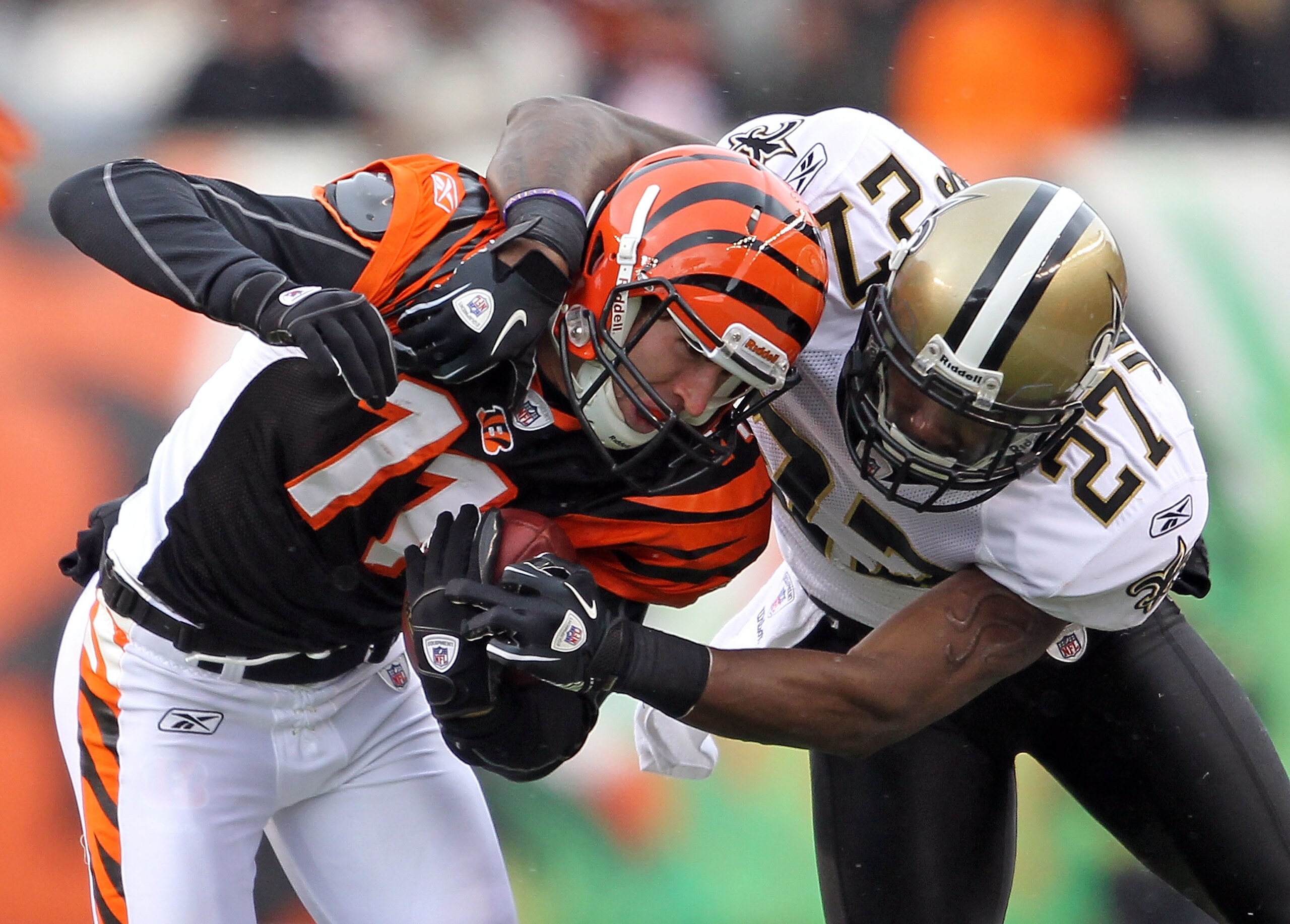 CINCINNATI, OH - DECEMBER 05:  Malcolm Jenkins #27 of the New Orleans Saints tackles Jordan Shipley #11 of the Cincinnati Bengals during the NFL game at Paul Brown Stadium on December 5, 2010 in Cincinnati, Ohio.  The Saints won 34-30.  (Photo by Andy Lyo