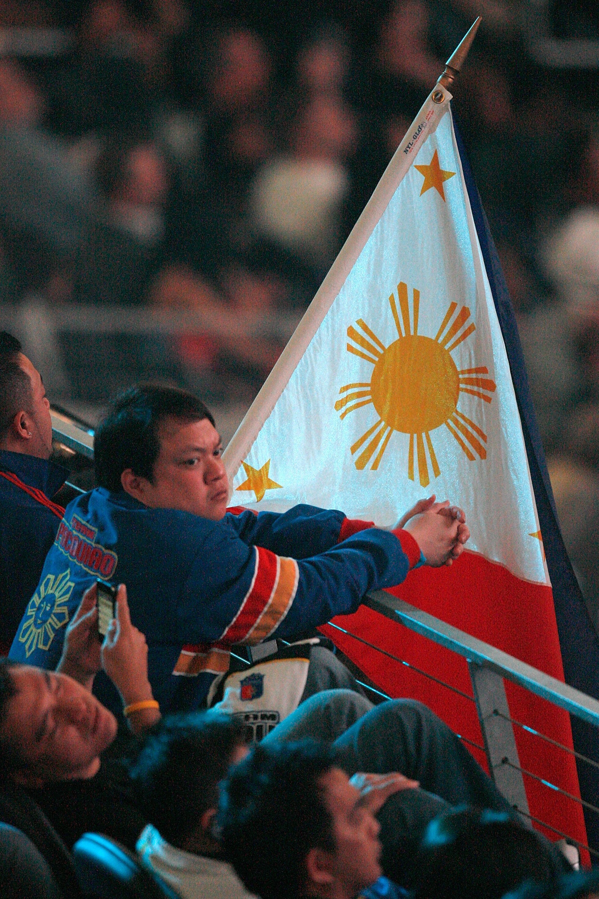 ARLINGTON, TX - MARCH 13:  A fan of Manny Pacquiao of the Philippines waits for Pacquiao to take on Joshua Clottey of Ghana before the WBO welterweight title fight at Cowboys Stadium on March 13, 2010 in Arlington, Texas. Pacquiao defeated Clottey by unan