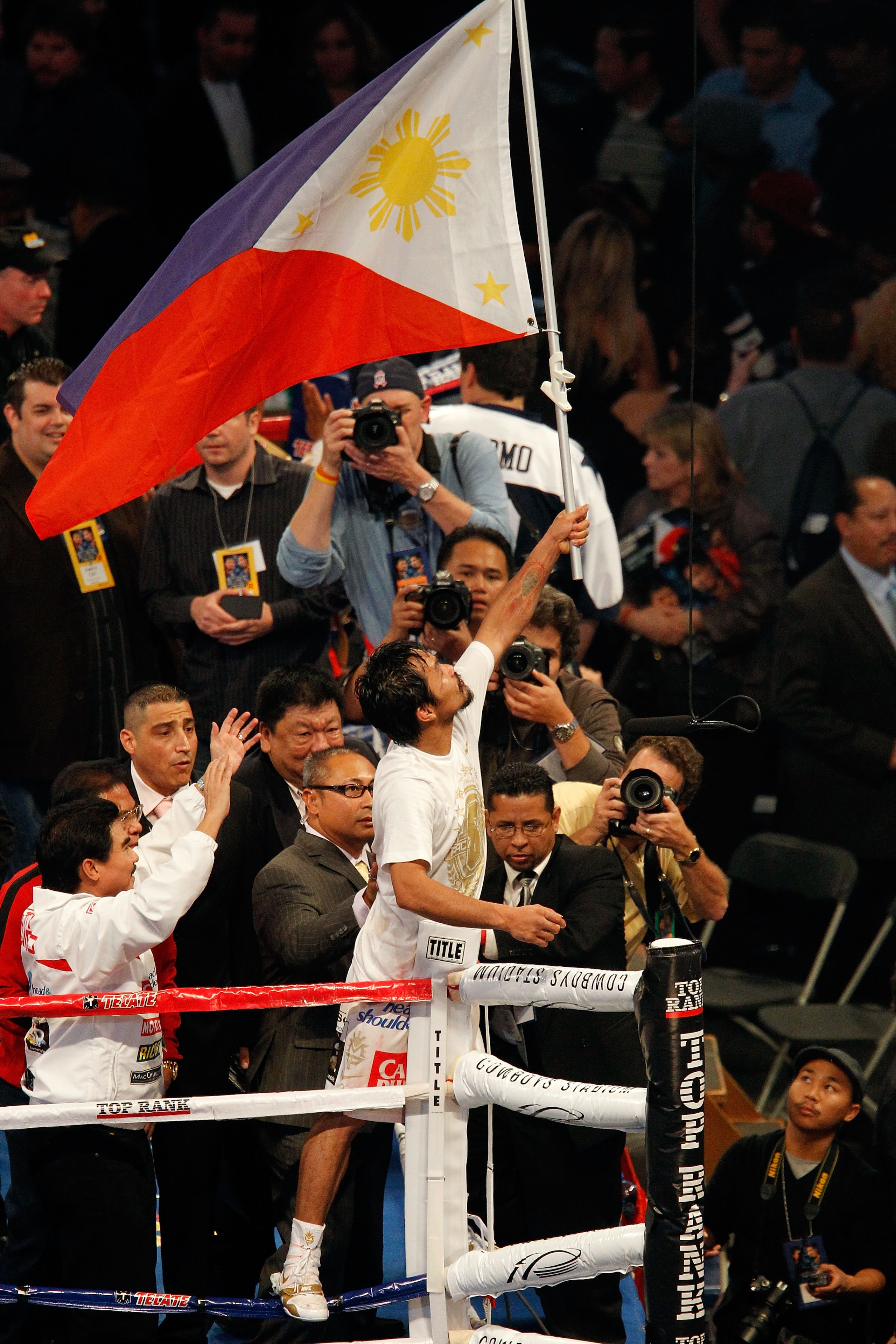 ARLINGTON, TX - NOVEMBER 13:  Manny Pacquiao (white trunks) of the Philippines celebrates after he was declared the winner by a unanimous decision against Antonio Margarito (black trunks) of Mexico during their WBC World Super Welterweight Title bout at C