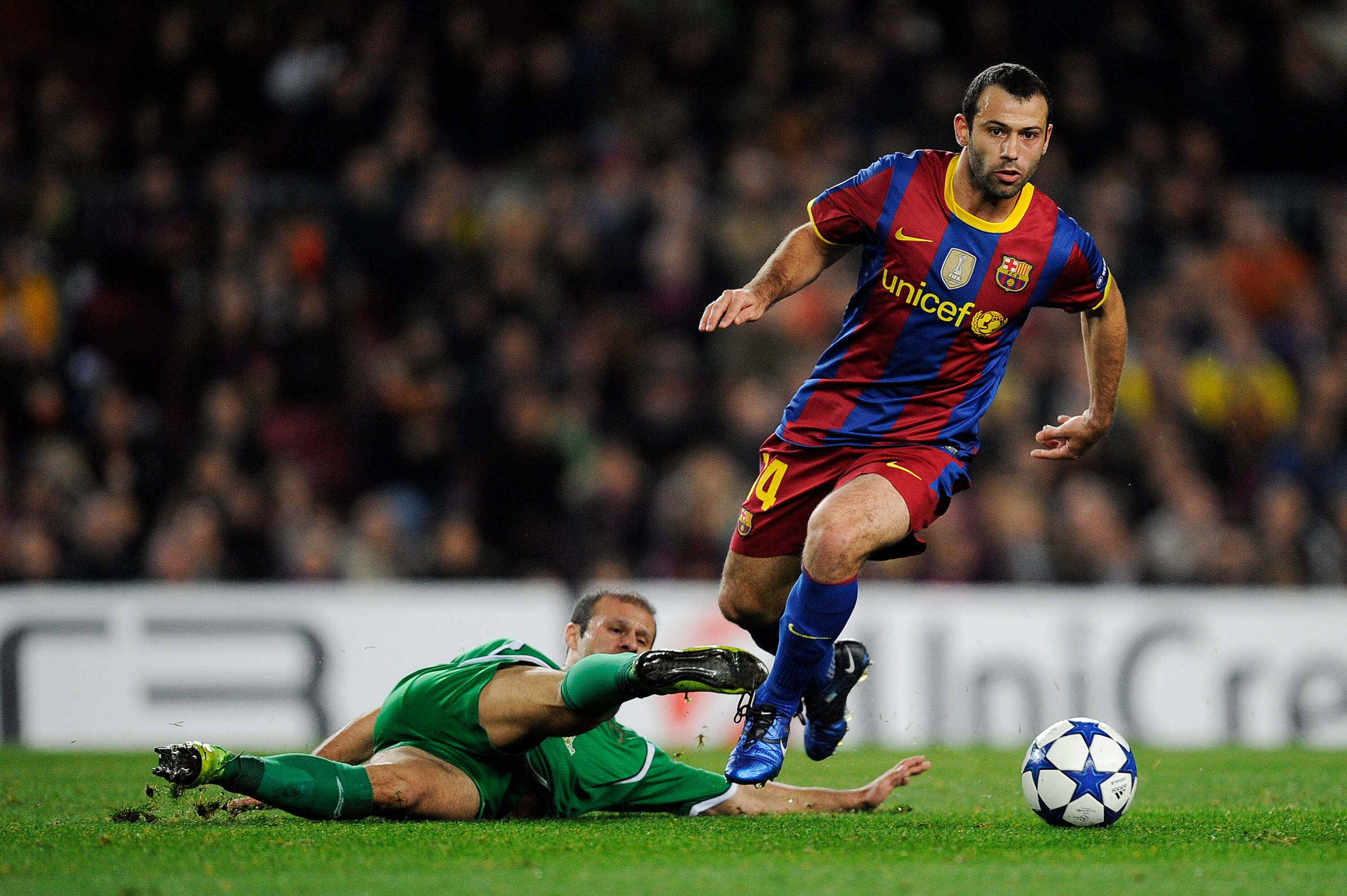 BARCELONA, SPAIN - DECEMBER 07:  Javier Mascherano of Barcelona (R) vies for the ball against Gokdeniz Karadeniz of Rubin Kazan during the Champions League match between Barcelona and Rubin Kazan at Camp Nou Stadiumon December 7, 2010 in Barcelona, Spain.