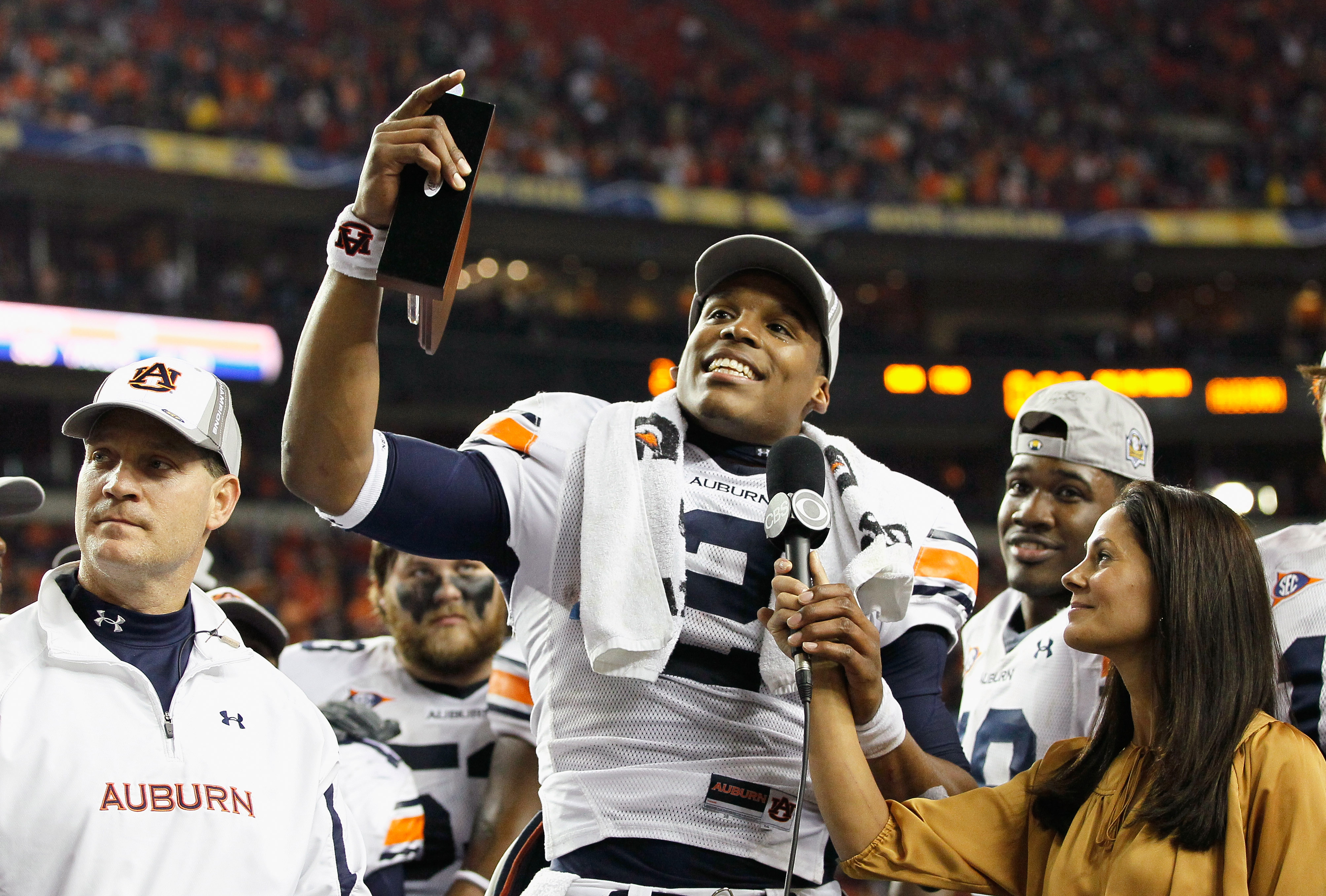 ATLANTA, GA - DECEMBER 04:  Quarterback Cam Newton #2 of the Auburn Tigers talks to CBS sideline reporter Tracy Wolfson after winning the MVP trophy in their 56-17 win over the South Carolina Gamecocks during the 2010 SEC Championship at Georgia Dome on D