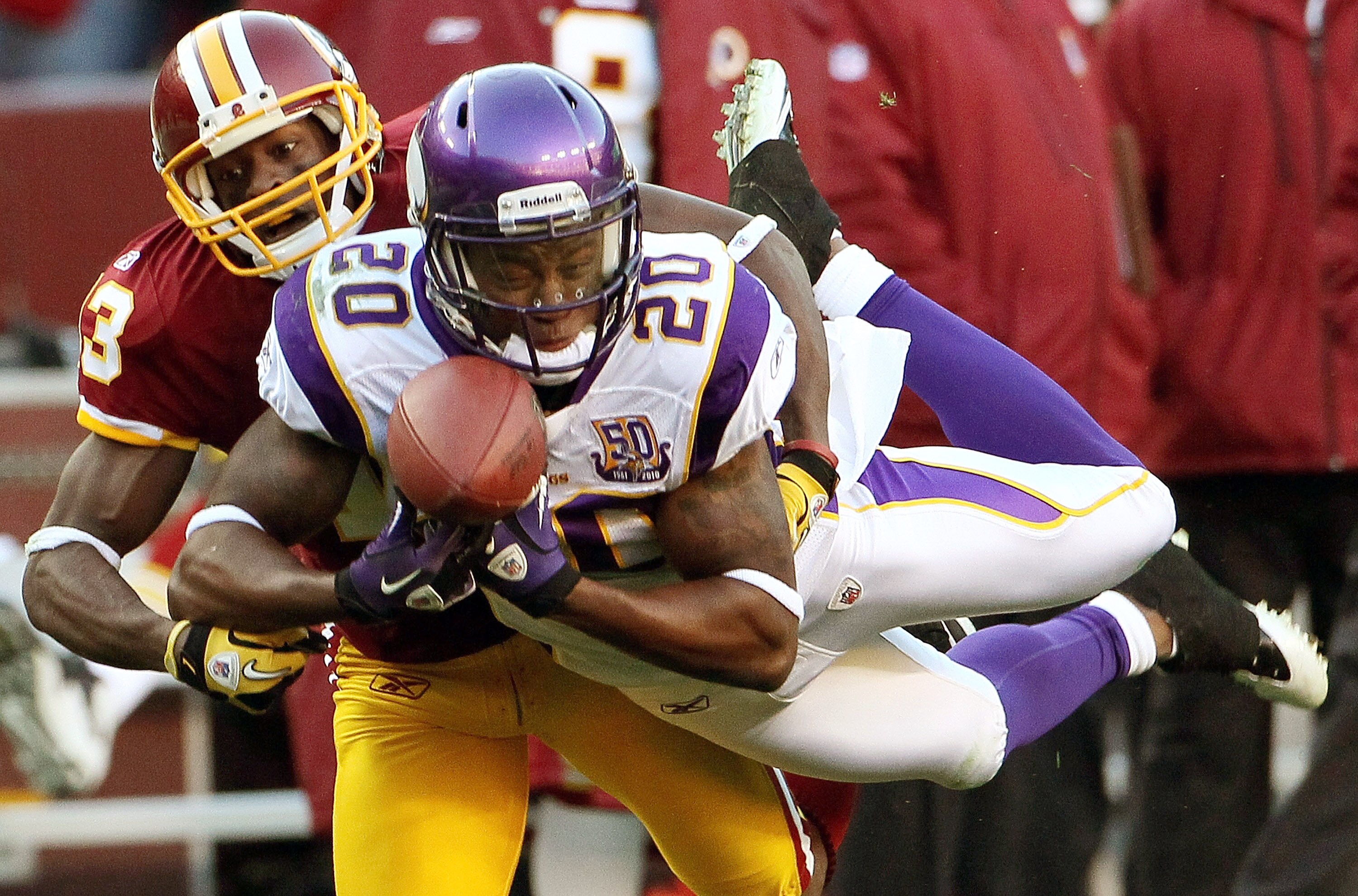 LANDOVER, MD - NOVEMBER 28: Safety Madieu Williams #20 of the Minnesota Vikings breaks up a pass intended for Anthony Armstrong #13 of the Washington Redskins at FedExField November 28, 2010 in Landover, Maryland. The Vikings won the game 17-13.  (Photo b