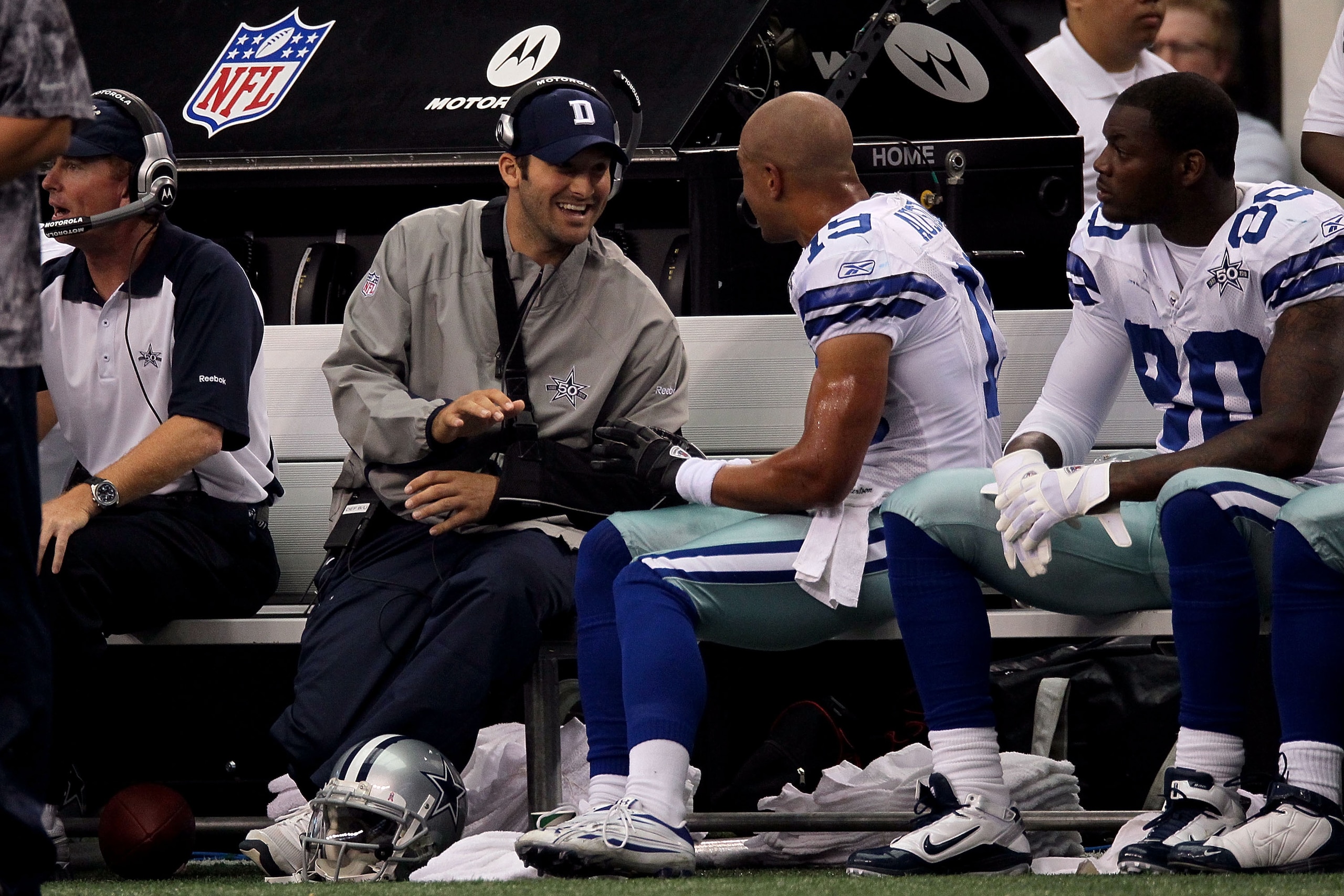 ARLINGTON, TX - OCTOBER 31:  Injured quarterback Tony Romo of the Dallas Cowboys talks with Miles Austin #19 against the Jacksonville Jaguars at Cowboys Stadium on October 31, 2010 in Arlington, Texas.  (Photo by Stephen Dunn/Getty Images)