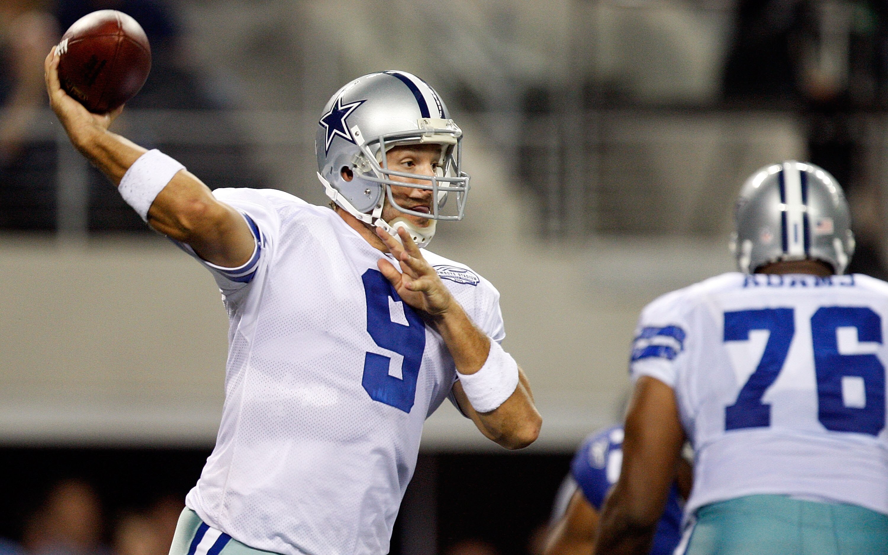 ARLINGTON, TX - SEPTEMBER 20:  Quarterback Tony Romo #9 of the Dallas Cowboys drops back to pass against the New York Giants at Cowboys Stadium on September 20, 2009 in Arlington, Texas.  (Photo by Ronald Martinez/Getty Images)