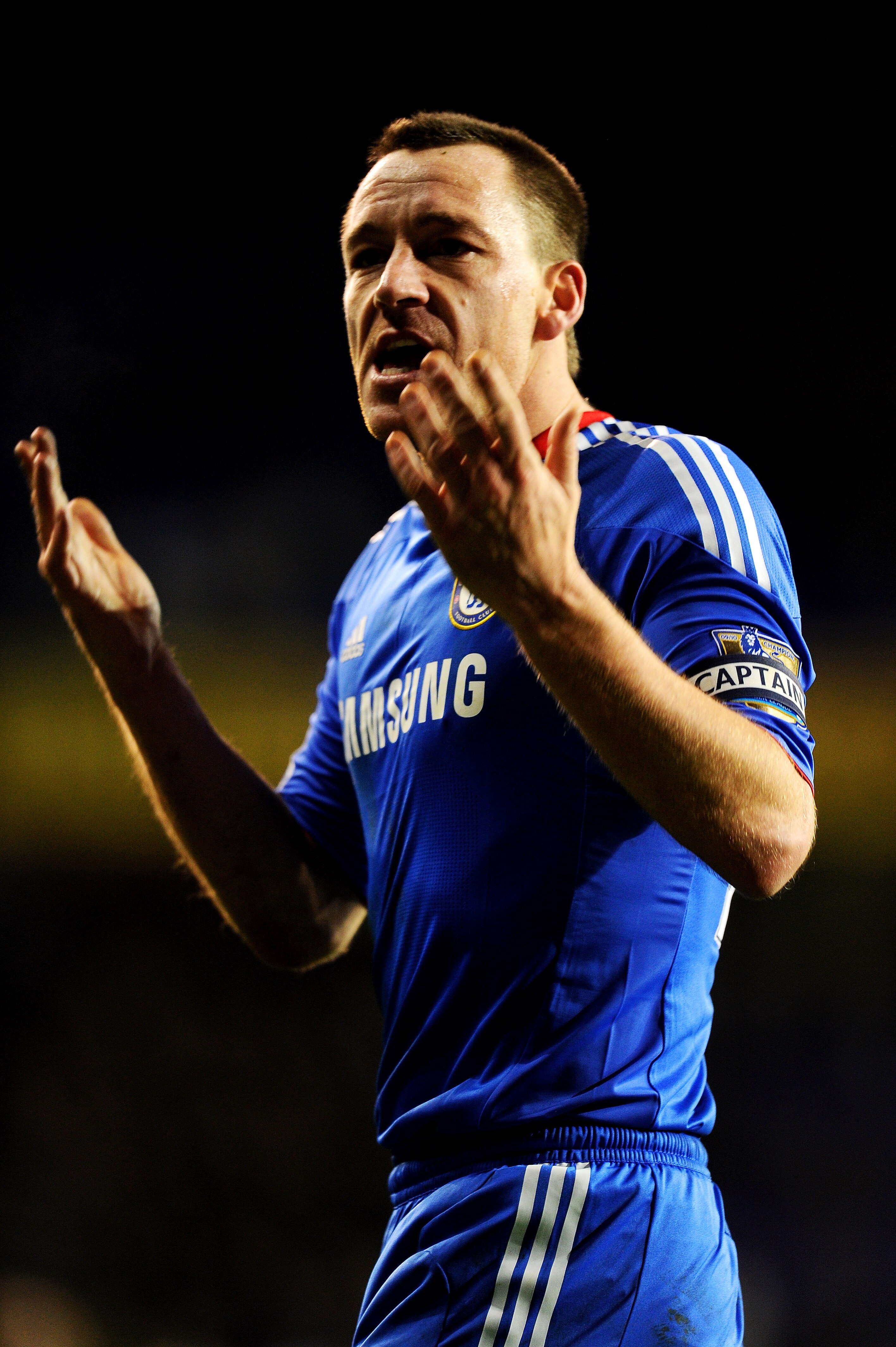 LONDON, ENGLAND - DECEMBER 12: John Terry of Chelsea reacts after being taunted by the Tottenham fans following the final whistle during the Barclays Premier League match between Tottenham Hotspur and Chelsea at White Hart Lane on December 12, 2010 in Lon