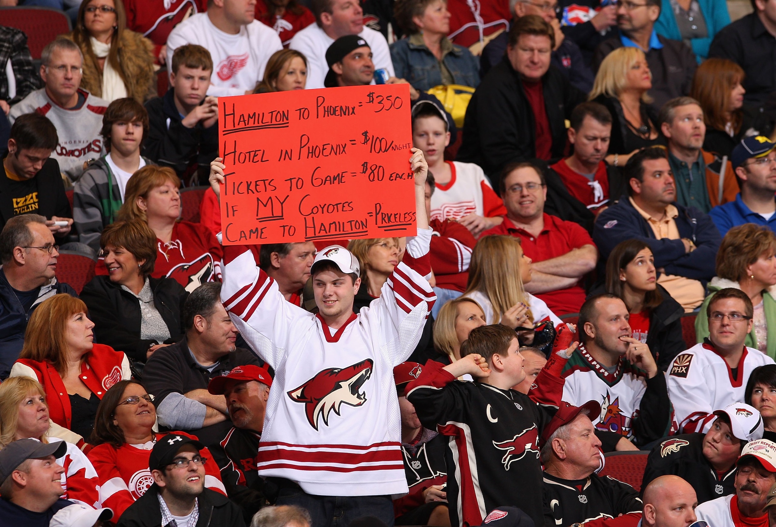 GLENDALE, AZ - JANUARY 02:  A fan of the Phoenix Coyotes holds up a sign during the NHL game against the Detroit Red Wings at Jobing.com Arena on January 2, 2010 in Glendale, Arizona. The Red Wings defeated the Coyotes 4-1.  (Photo by Christian Petersen/G