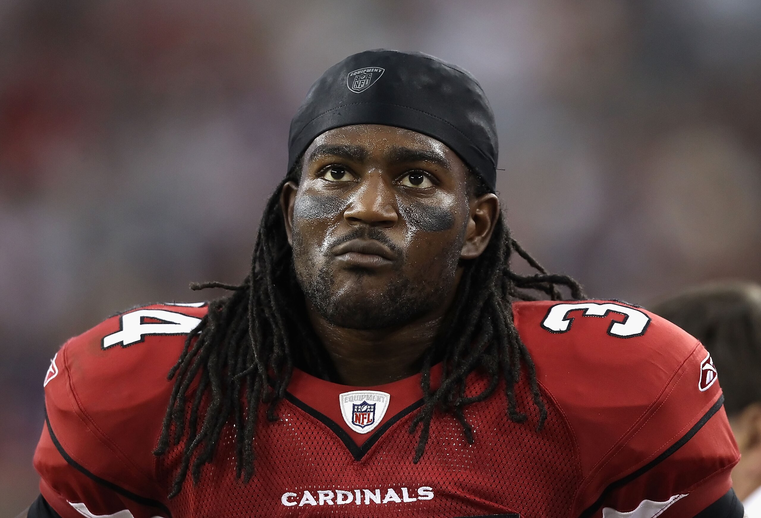 GLENDALE, AZ - DECEMBER 12: Runningback Tim Hightower #34 of the Arizona Cardinals stands on the sidelines during the NFL game against the Denver Broncos at the University of Phoenix Stadium on December 12, 2010 in Glendale, Arizona. The Cardinals defea GLENDALE, AZ - DECEMBER 12: Runningback Tim Hightower #34 of the Arizona Cardinals stands on the sidelines during the NFL game against the Denver Broncos at the University of Phoenix Stadium on December 12, 2010 in Glendale, Arizona. The Cardinals defea