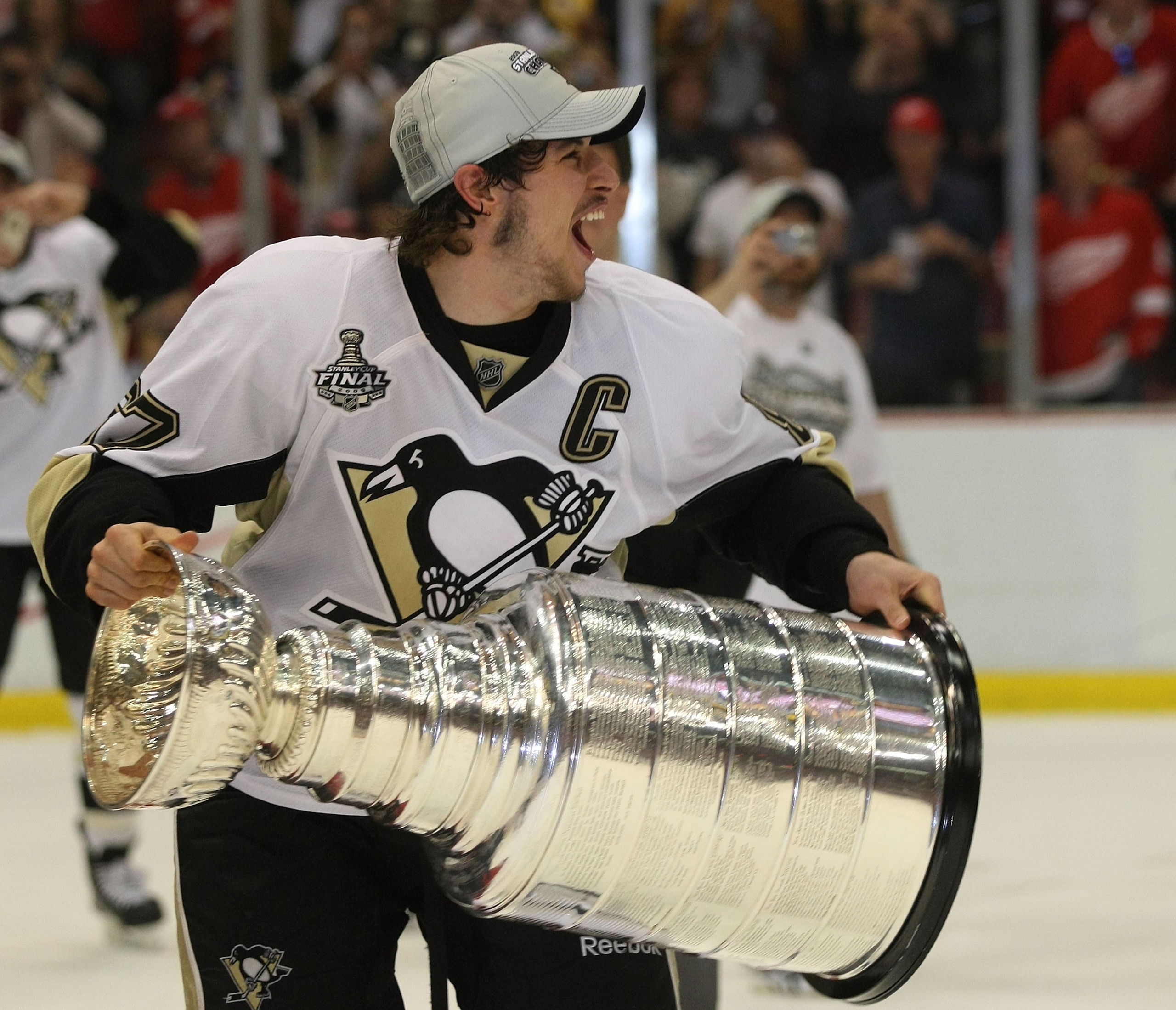 DETROIT - JUNE 12:  Sidney Crosby #87 of the Pittsburgh Penguins celebrates with the Stanley Cup following the Penguins victory over the Detroit Red Wings in Game Seven of the 2009 NHL Stanley Cup Finals at Joe Louis Arena on June 12, 2009 in Detroit, Mic