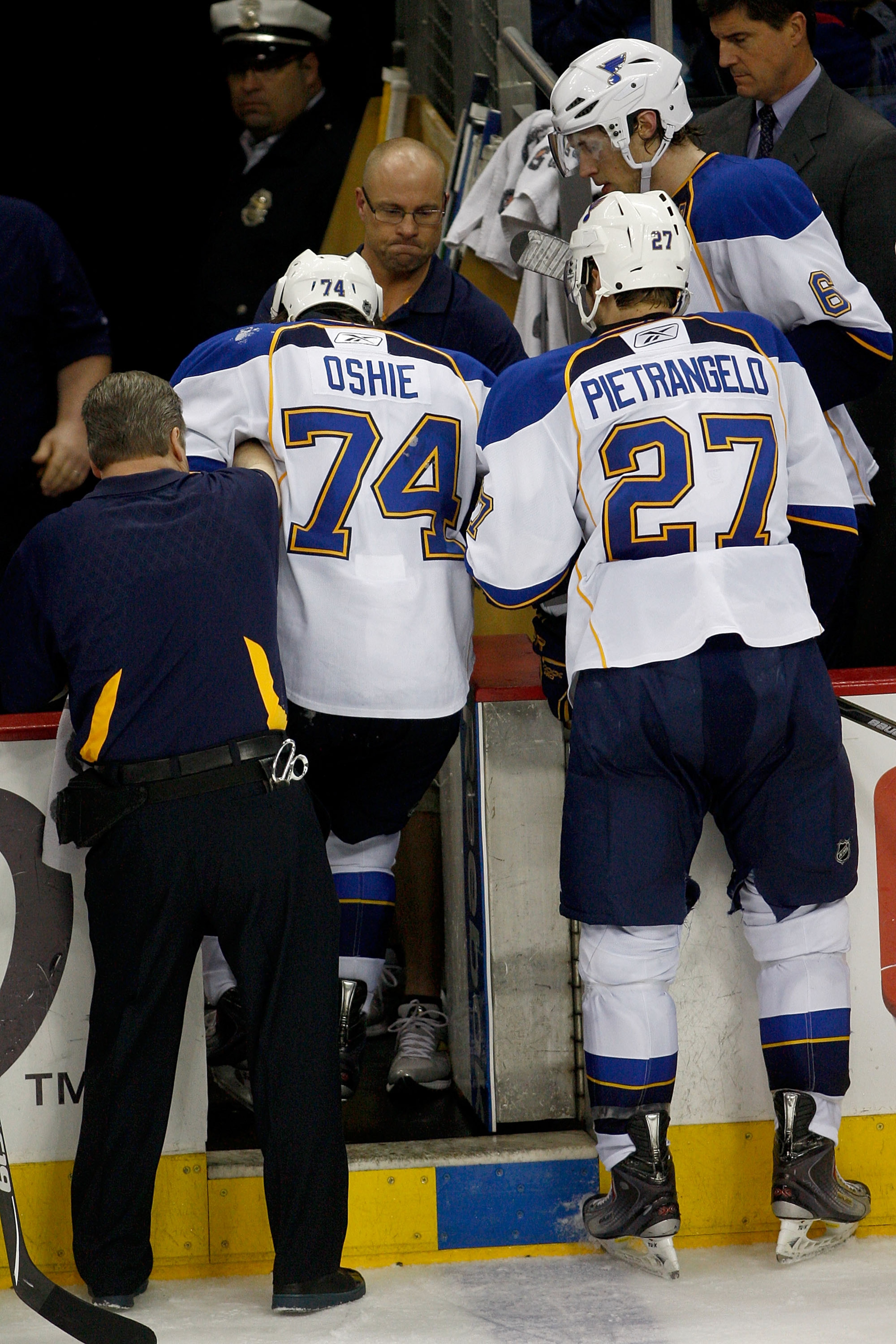 COLUMBUS,OH - NOVEMBER 10: Alex Pietrangelo #27 of the St. Louis Blues helps teammate T.J. Oshie #74 of the St. Louis Blues leave the ice after he was injured during the third period against the Columbus Blue Jackets on November 10, 2010 at Nationwide Ar COLUMBUS,OH - NOVEMBER 10: Alex Pietrangelo #27 of the St. Louis Blues helps teammate T.J. Oshie #74 of the St. Louis Blues leave the ice after he was injured during the third period against the Columbus Blue Jackets on November 10, 2010 at Nationwide Ar