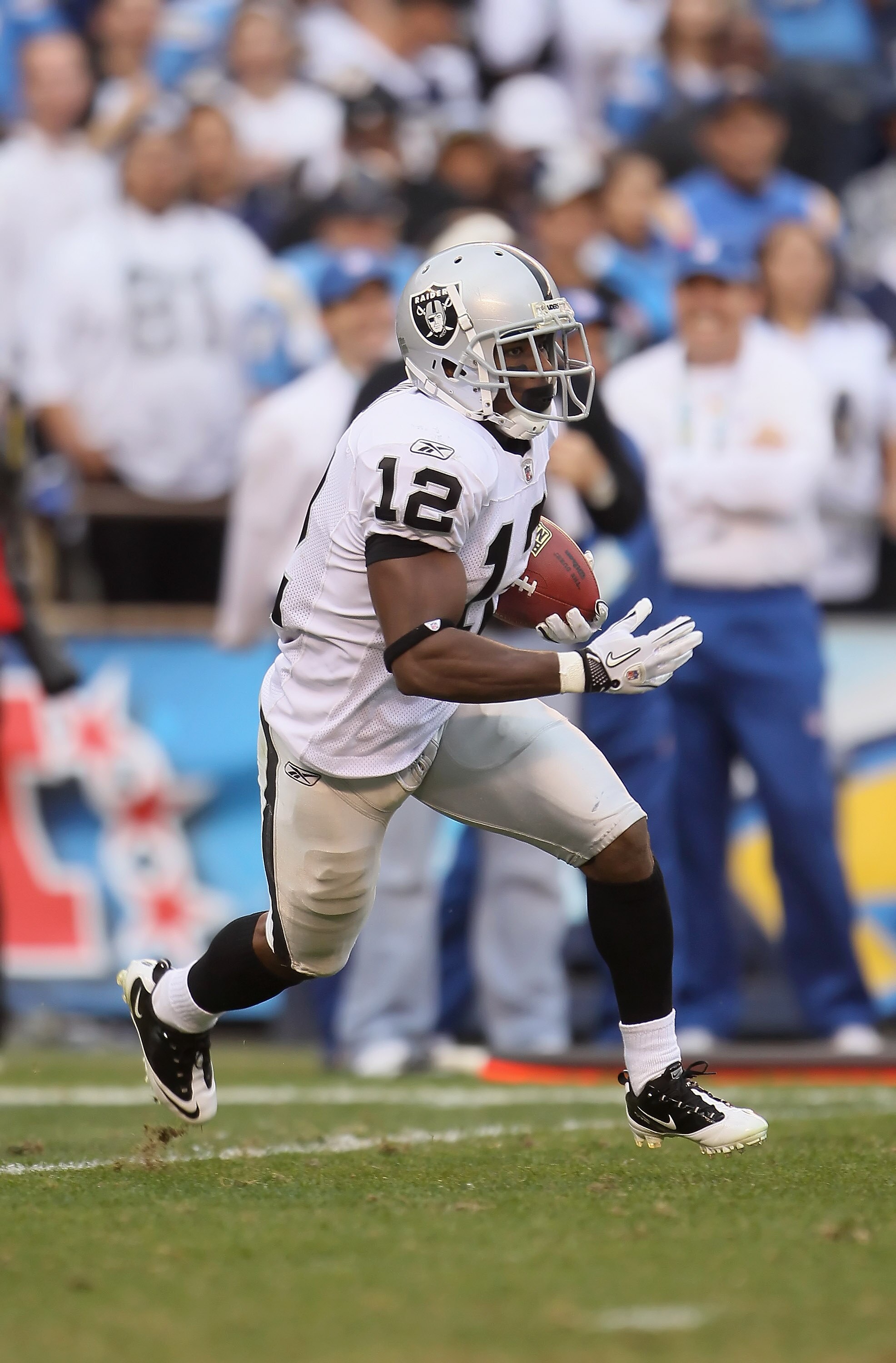 SAN DIEGO - DECEMBER 05:  Jacoby Ford #12 the Oakland Raiders carries the ball against the San Diego Chargers at Qualcomm Stadium on December 5, 2010 in San Diego, California. The Raiders defeated the Chargers 28-13.  (Photo by Jeff Gross/Getty Images)