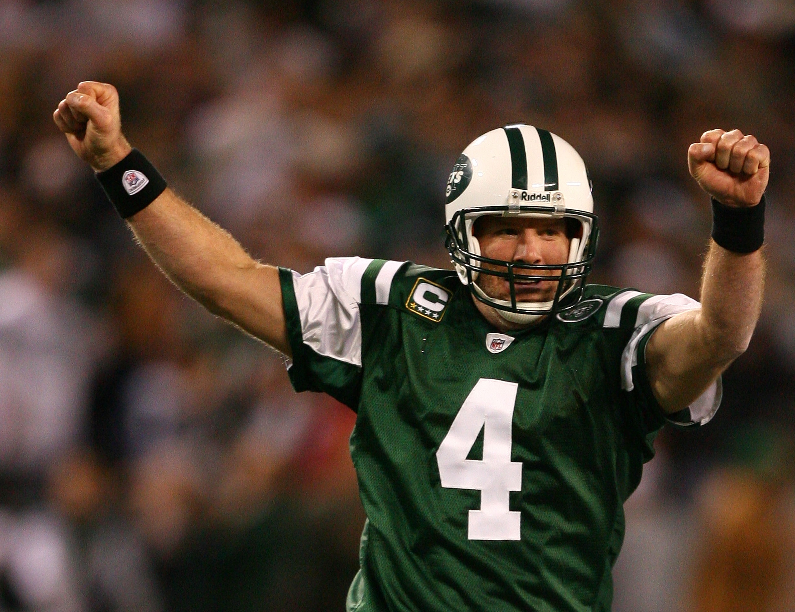 EAST RUTHERFORD, NJ - DECEMBER 28: Brett Favre #4 of The New York Jets celebrates after throwing a touchdown to Laveranues Coles #87 against The Miami Dolphins during their game on December 28, 2008 at Giants Stadium in East Rutherford, New Jersey. (Photo