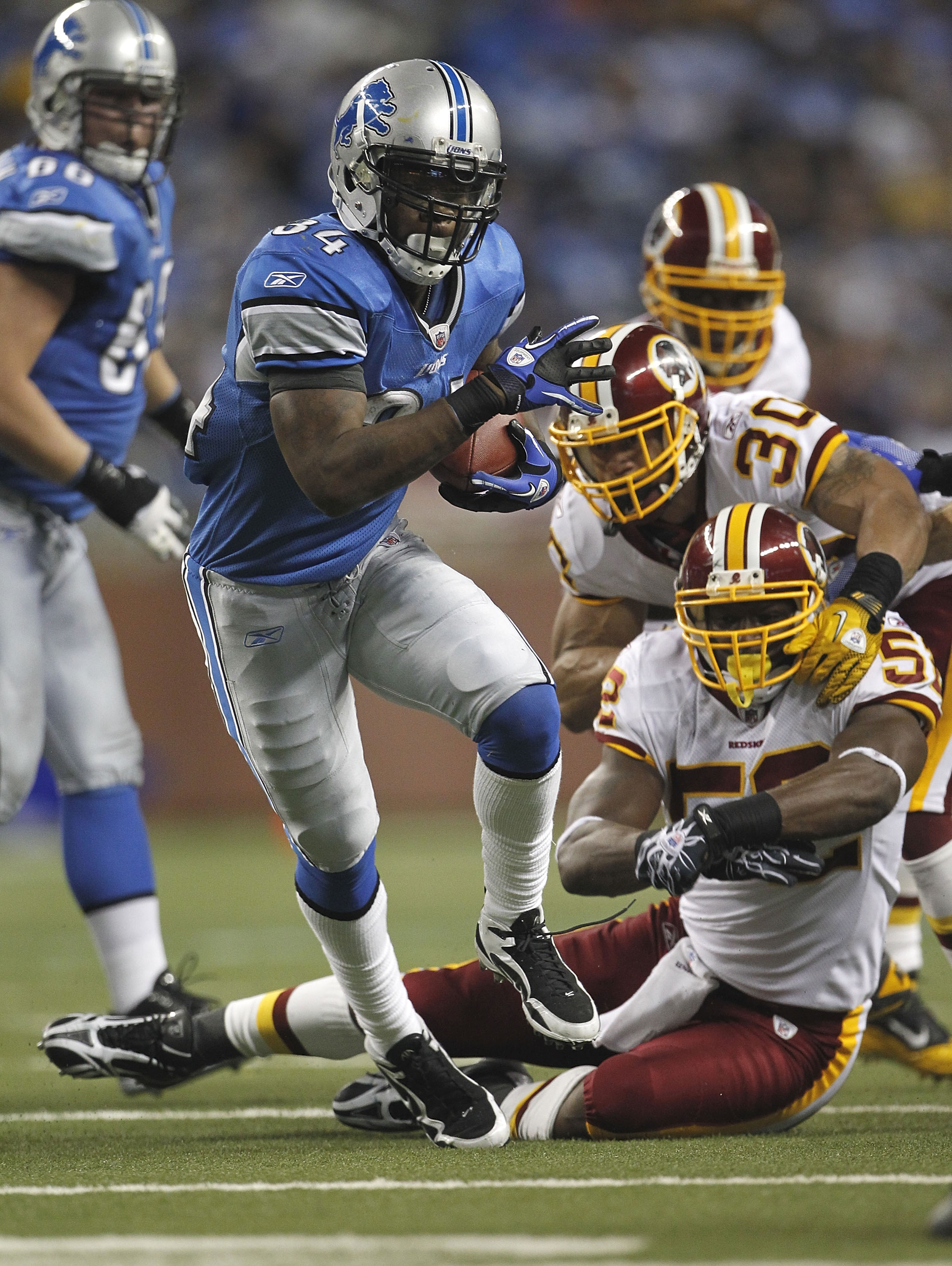 DETROIT - OCTOBER 31: Kevin Smith #34 of the Detroit Lions runs for a first down during the fourth quarter of the game against the Washington Redskins at Ford Field on October 31, 2010 in Detroit, Michigan. The Lions defeated the Redskins 37-25.  (Photo b