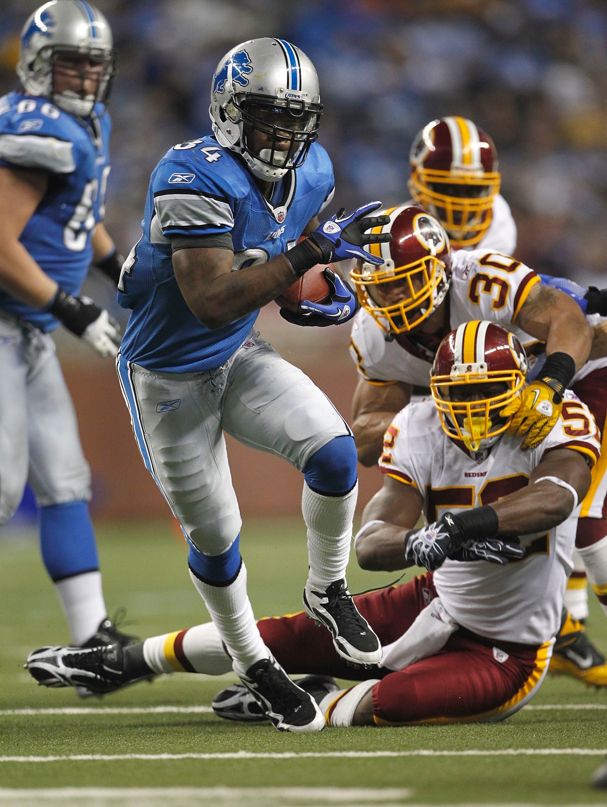 DETROIT - OCTOBER 31: Kevin Smith #34 of the Detroit Lions runs for a first down during the fourth quarter of the game against the Washington Redskins at Ford Field on October 31, 2010 in Detroit, Michigan. The Lions defeated the Redskins 37-25.  (Photo b