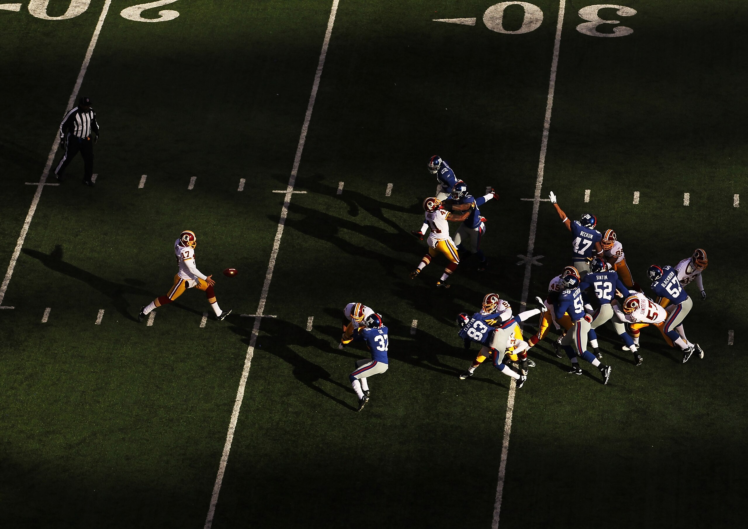 EAST RUTHERFORD, NJ - DECEMBER 05:  Hunter Smith #17 of the Washington Redskins punts the ball against the New York Giants during their game on December 5, 2010 at The New Meadowlands Stadium in East Rutherford, New Jersey.  (Photo by Al Bello/Getty Image