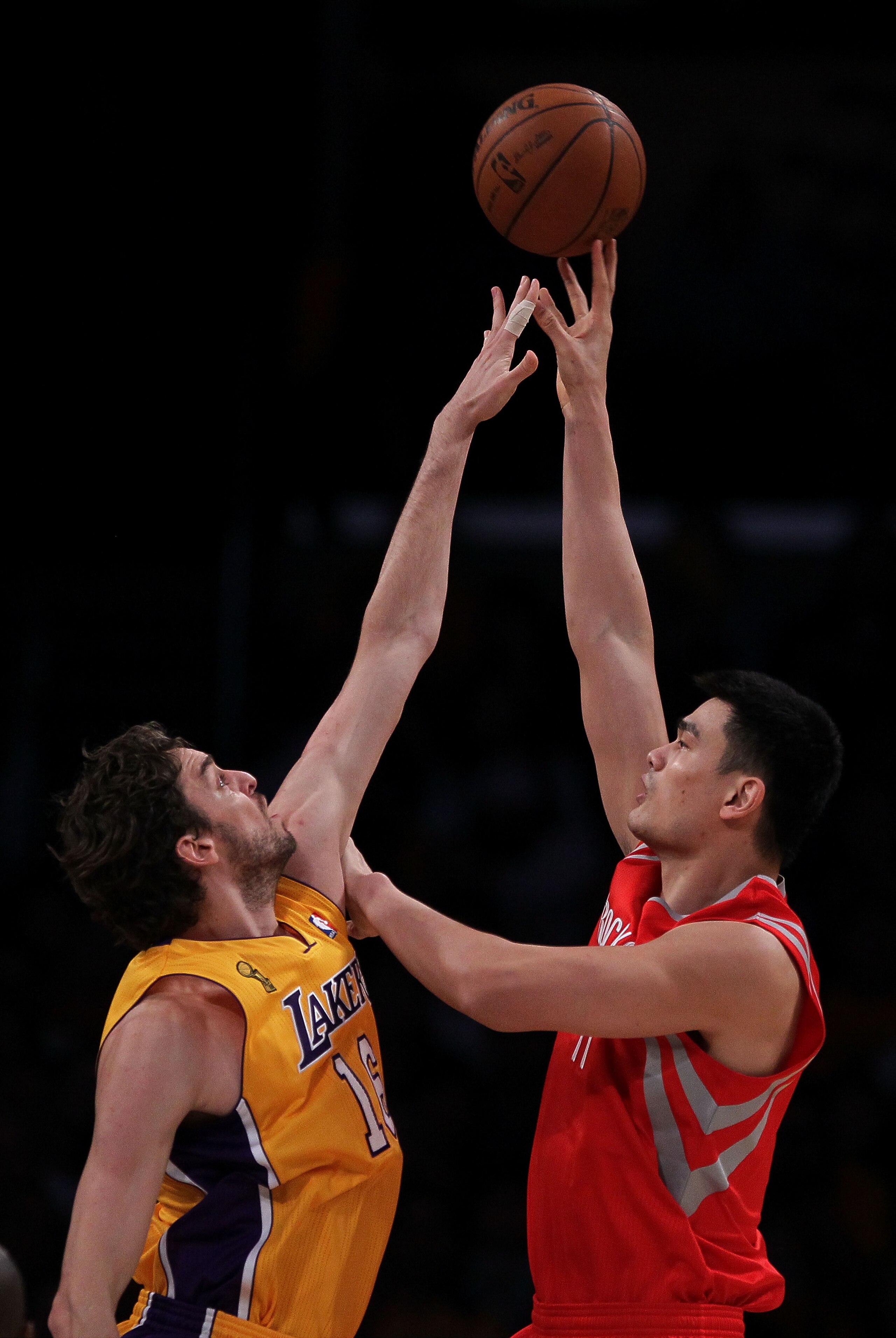 LOS ANGELES, CA - OCTOBER 26: Yao Ming #11 of the Houston Rockets takes a shot over Pau Gasol #16 of the Los Angeles Lakers in the first quarter of their opening night game at Staples Center on October 26, 2010 in Los Angeles, California. NOTE TO USER: Us