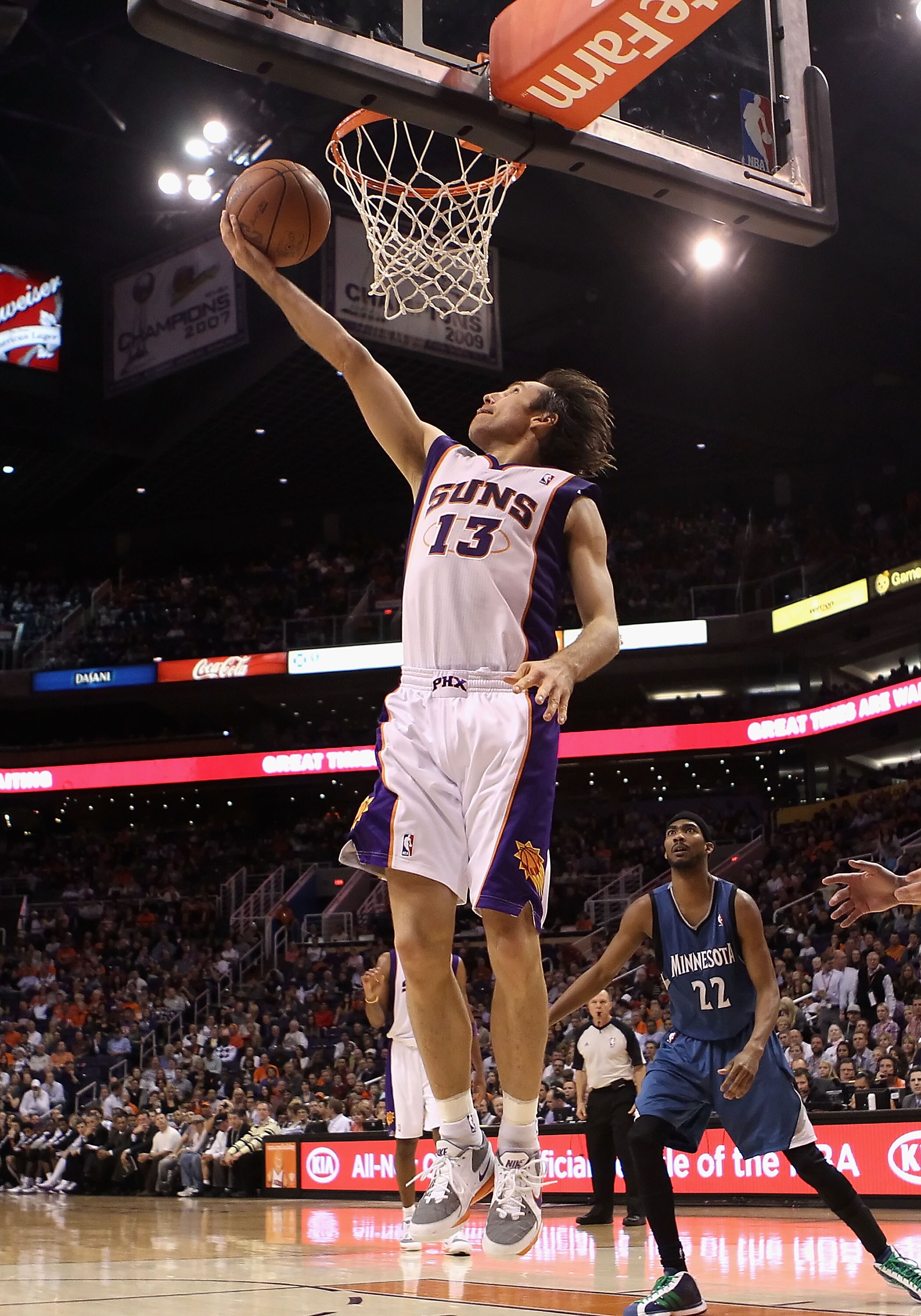 PHOENIX - DECEMBER 15:  Steve Nash #13 of the Phoenix Suns lays up a shot against the Minnesota Timberwolves during the NBA game at US Airways Center on December 15, 2010 in Phoenix, Arizona.  The Suns defeated the Timberwolves 128-122.  NOTE TO USER: Use