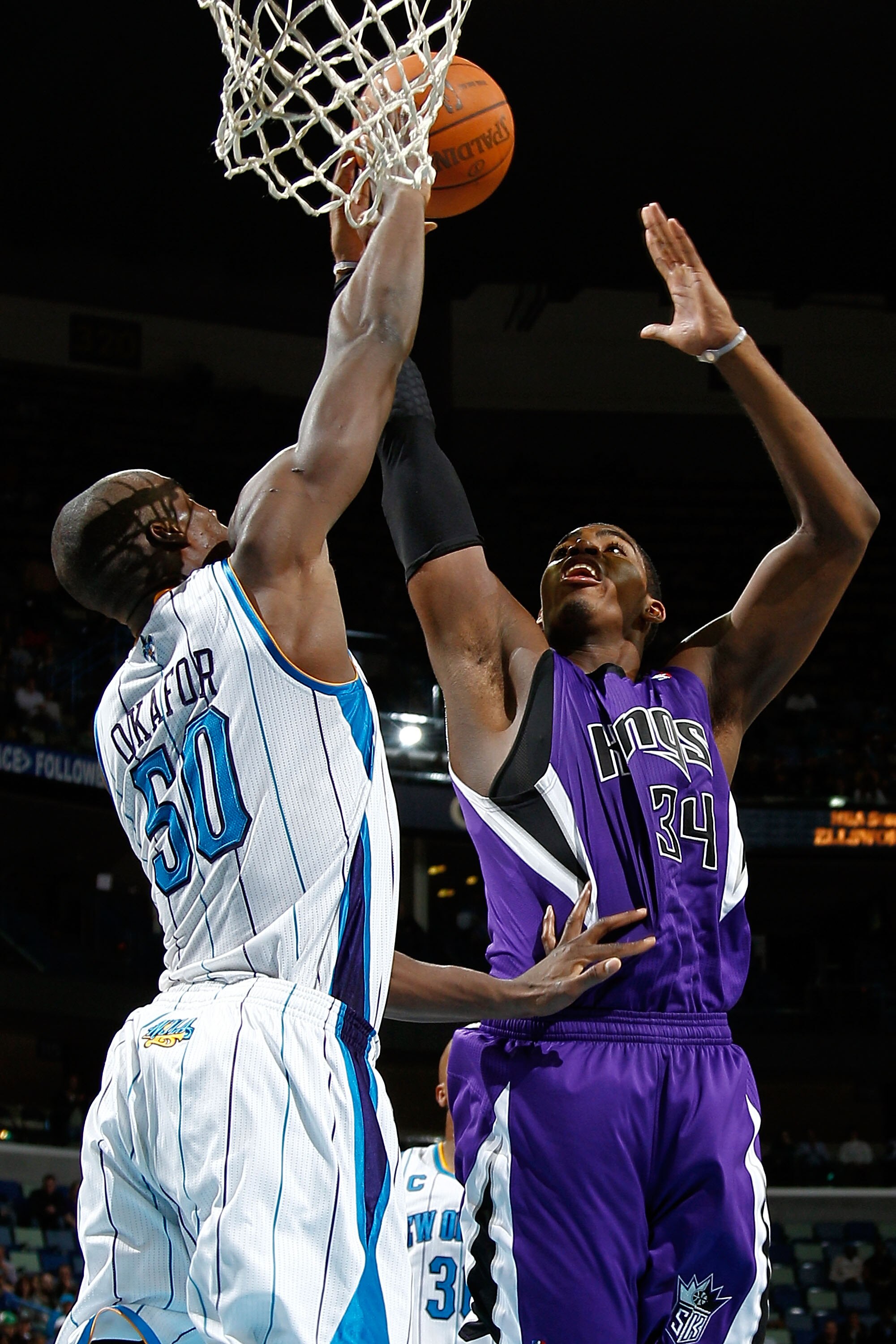 NEW ORLEANS, LA - DECEMBER 15:  Jason Thompson #34 of the Sacramento Kings shoots the ball over Emeka Okafor #50 of the New Orleans Hornets  at the New Orleans Arena on December 15, 2010 in New Orleans, Louisiana.  The Hornets defeated the Kings 94-91.  N
