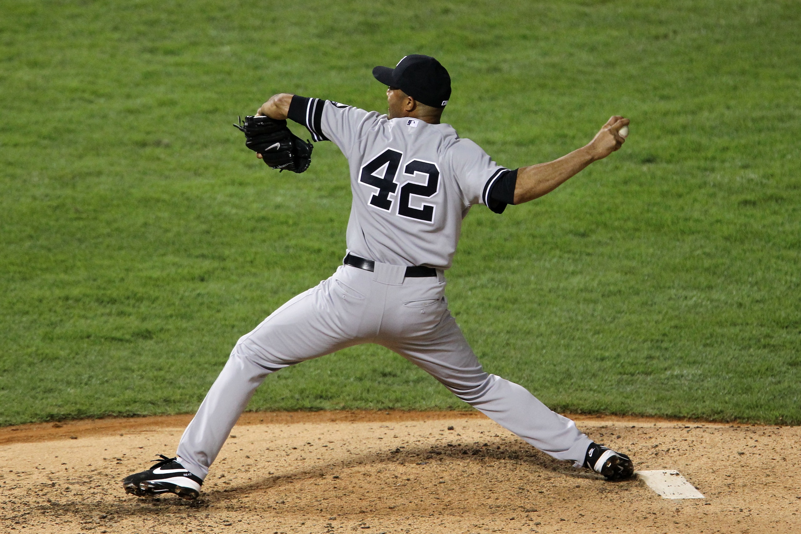 ARLINGTON, TX - OCTOBER 22:  Mariano Rivera #42 of the New York Yankees throws a pitch against the Texas Rangers in Game Six of the ALCS during the 2010 MLB Playoffs at Rangers Ballpark in Arlington on October 22, 2010 in Arlington, Texas.  (Photo by Rona