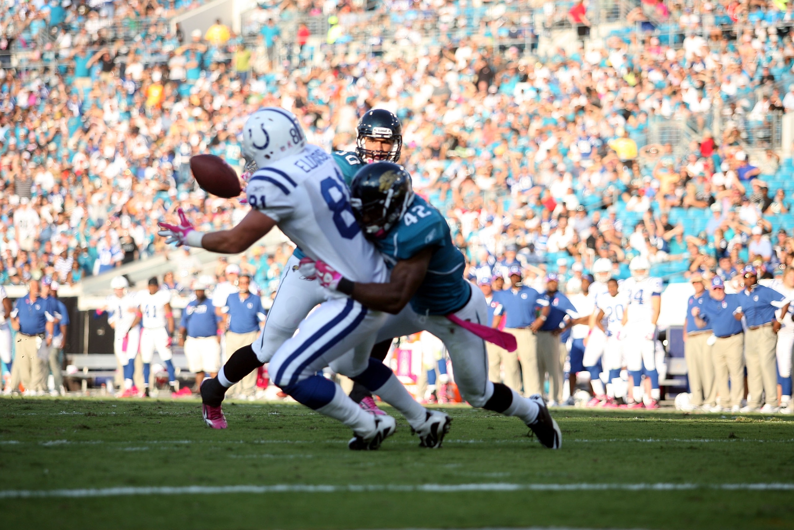 JACKSONVILLE, FL - OCTOBER 03:  Tight end Brody Eldridge #81 of the Indianapolis Colts cannot hold onto a pass that was intercepted by safety Anthony Smith #20 (L) of the Jacksonville Jaguars at EverBank Field on October 3, 2010 in Jacksonville, Florida.