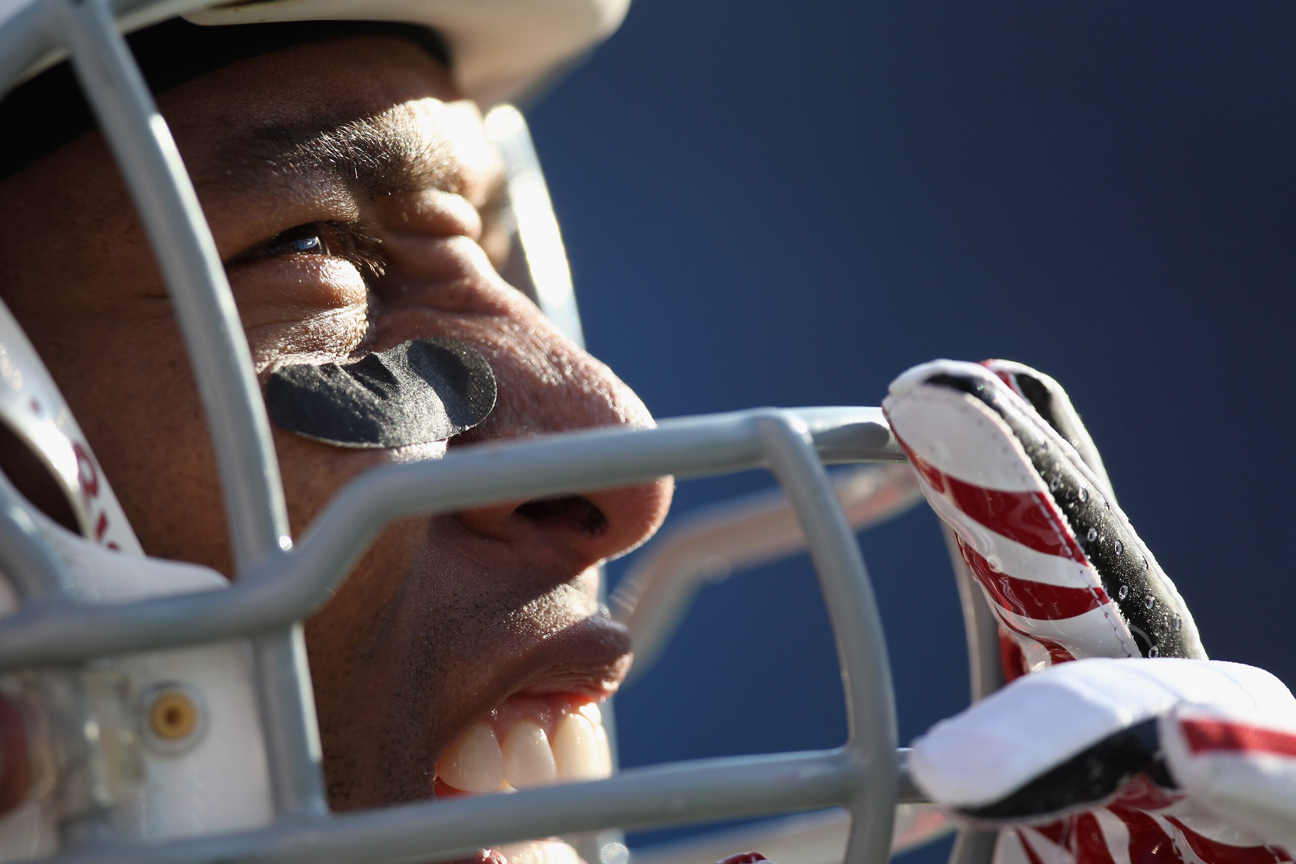 CHARLOTTE, NC - DECEMBER 19:  Larry Fitzgerald #11 of the Arizona Cardinals watches the scoreboard as he waits to go back in the game against the Carolina Panthers at Bank of America Stadium on December 19, 2010 in Charlotte, North Carolina.  (Photo by St