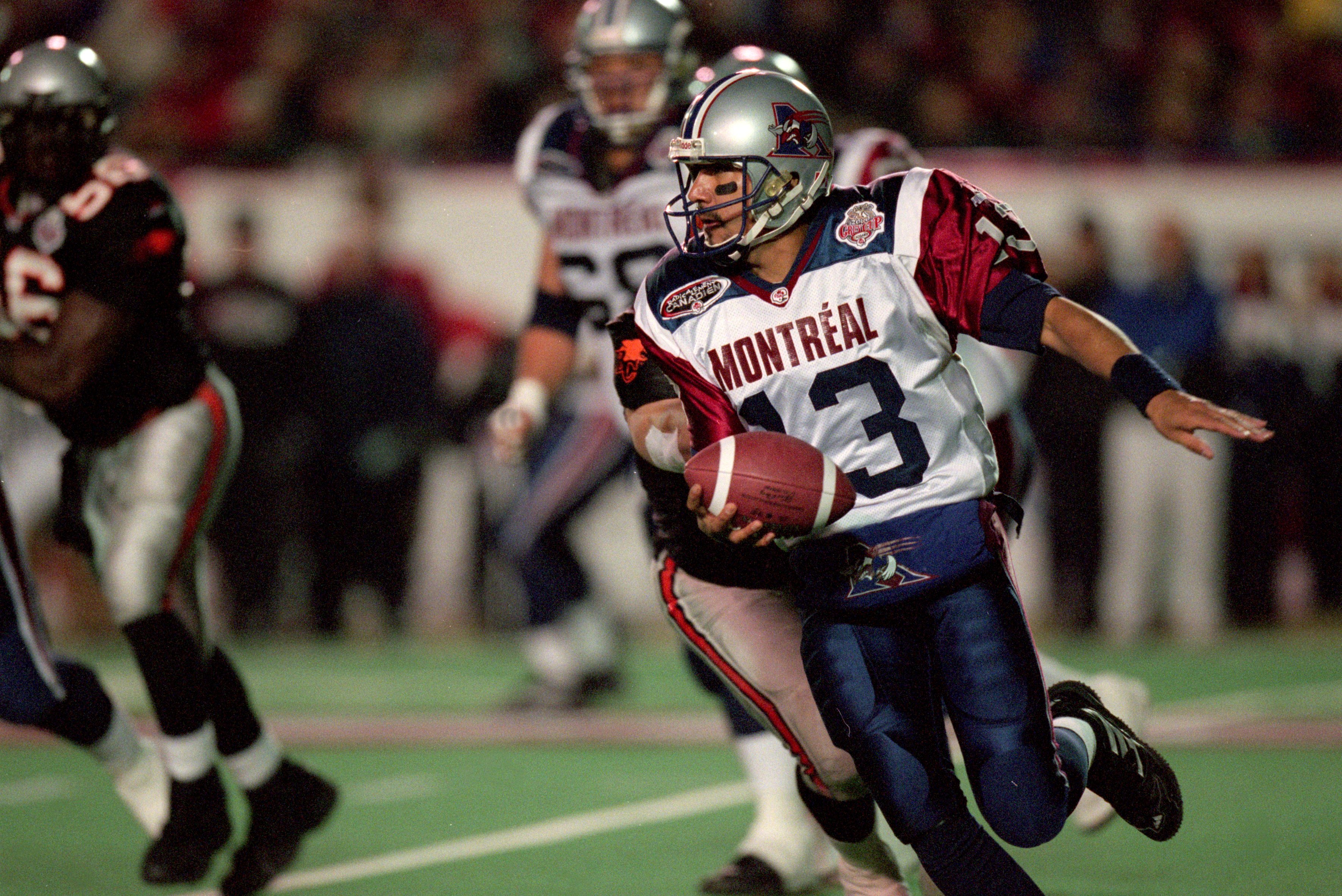 26 Nov 2000:  Anthony Calvillo #13 of the Montreal Alouettes runs with the ball during the Grey Cup 2000 game against the British Columbia Lions at the McMahon Stadium in Calgary, Alberta, Canada. The Lions defeated the Alouettes 28-26.Mandatory Credit: C