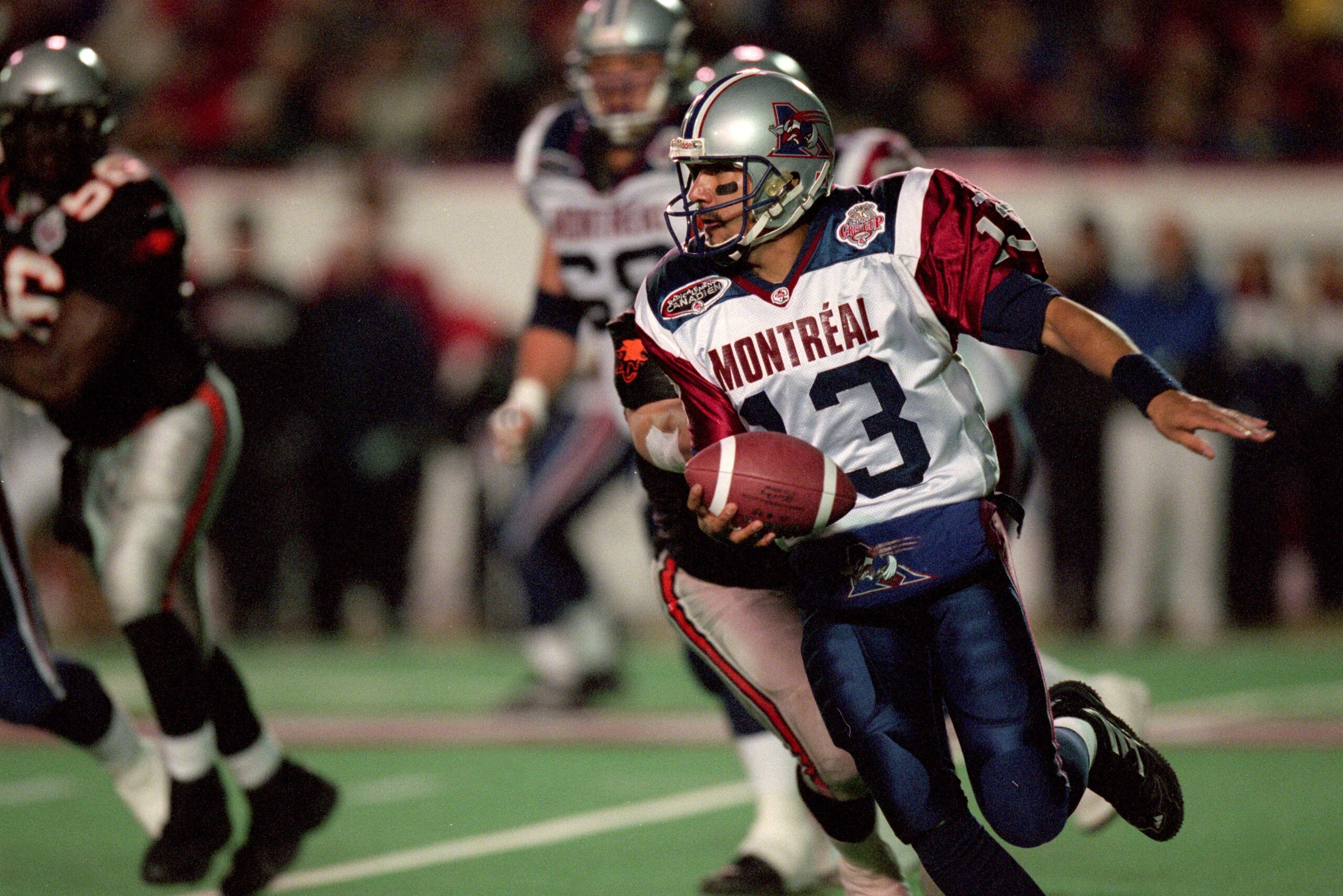 26 Nov 2000:  Anthony Calvillo #13 of the Montreal Alouettes runs with the ball during the Grey Cup 2000 game against the British Columbia Lions at the McMahon Stadium in Calgary, Alberta, Canada. The Lions defeated the Alouettes 28-26.Mandatory Credit: C