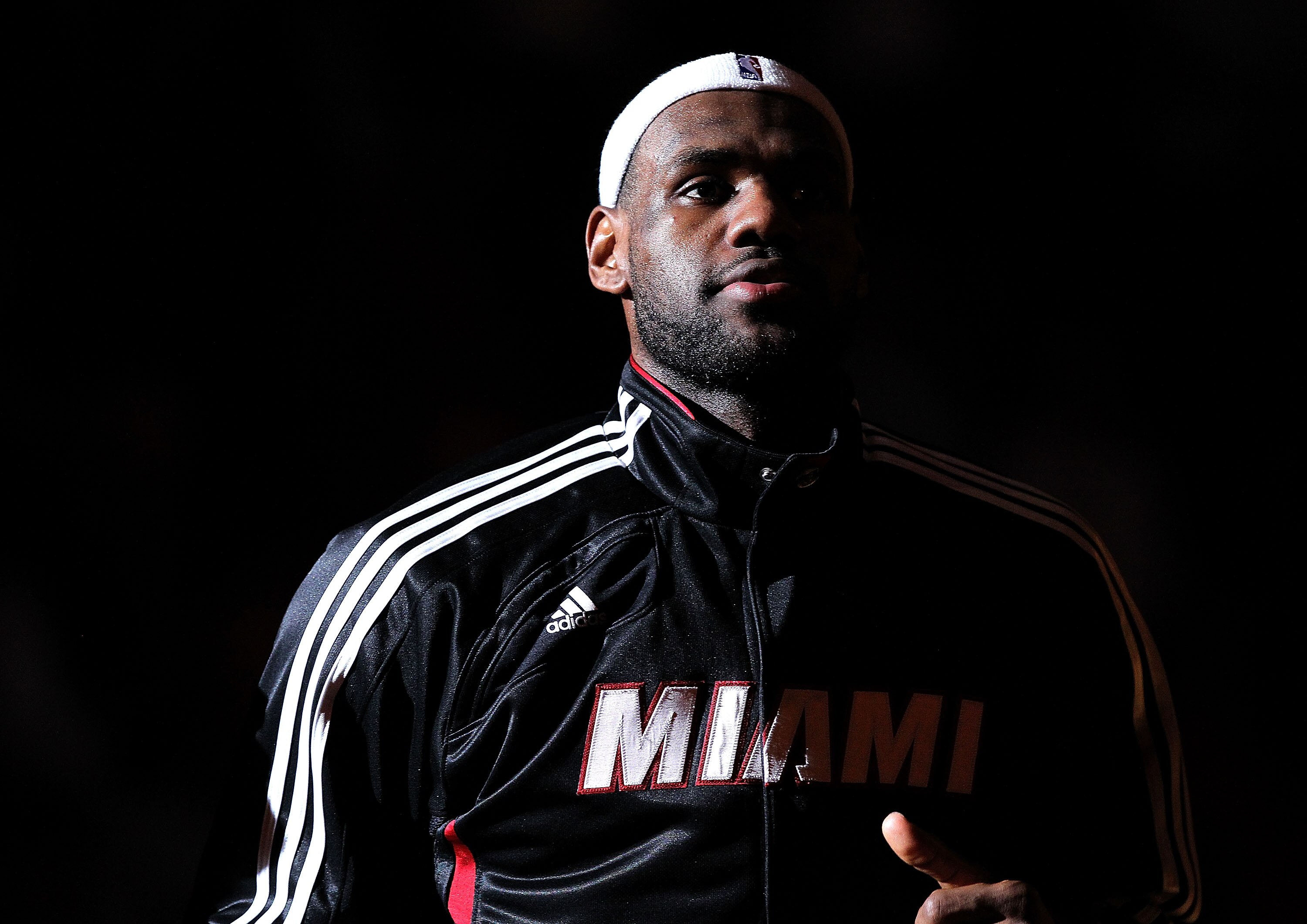 MIAMI, FL - DECEMBER 13:  LeBron James #6 of the Miami Heat greets his teammates during anouncements during a game against the New Orleans Hornets at American Airlines Arena on December 13, 2010 in Miami, Florida. NOTE TO USER: User expressly acknowledges