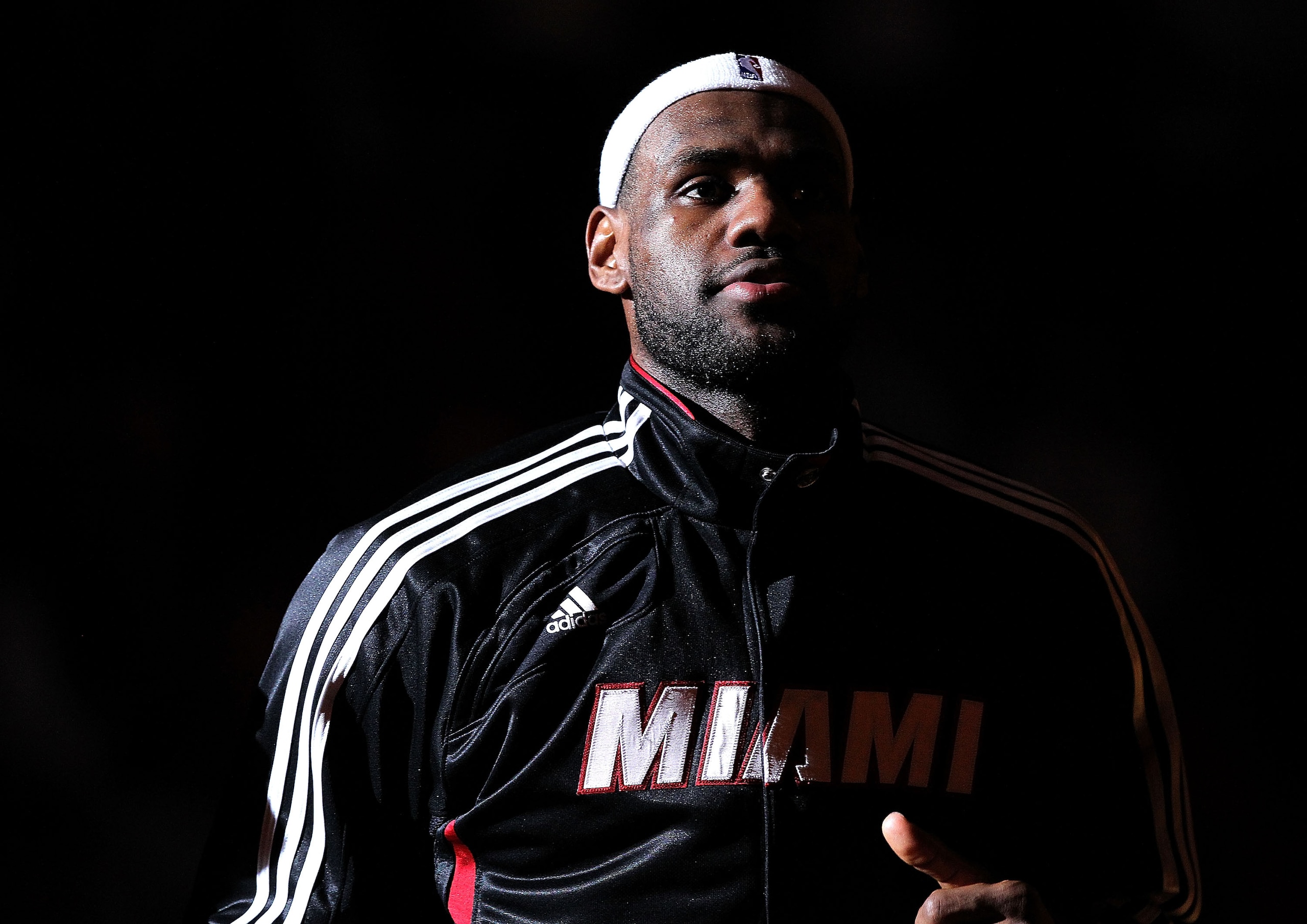 MIAMI, FL - DECEMBER 13:  LeBron James #6 of the Miami Heat greets his teammates during anouncements during a game against the New Orleans Hornets at American Airlines Arena on December 13, 2010 in Miami, Florida. NOTE TO USER: User expressly acknowledges