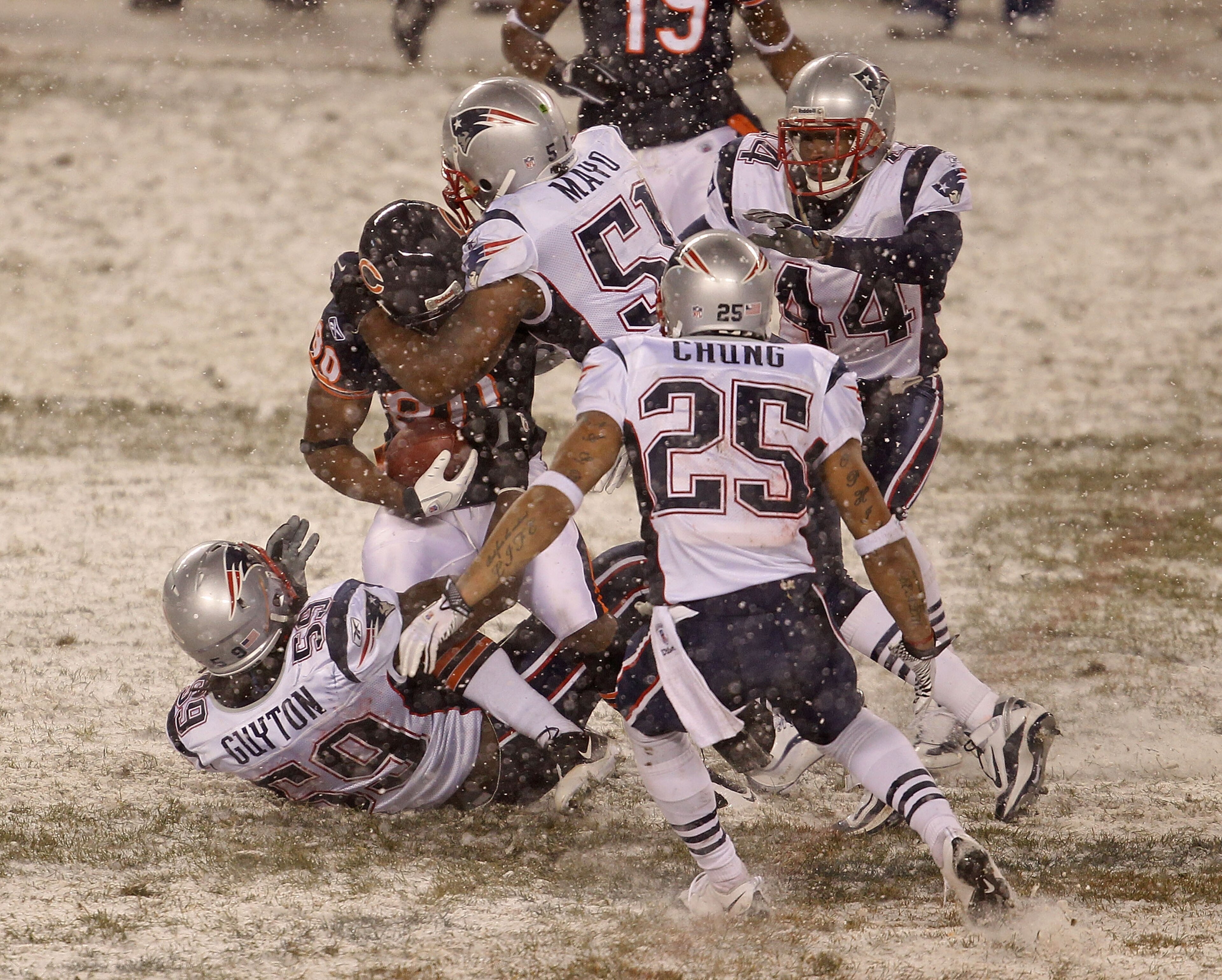 CHICAGO - DECEMBER 12: Earl Bennett #80 of the Chicago Bears is gang-tackled by Gary Guyton #59, Jerod Mayo #51, Patrick Chung #25 and Jarred Page #44 of the New England Patriots at Soldier Field on December 12, 2010 in Chicago, Illinois. The Patriots def CHICAGO - DECEMBER 12: Earl Bennett #80 of the Chicago Bears is gang-tackled by Gary Guyton #59, Jerod Mayo #51, Patrick Chung #25 and Jarred Page #44 of the New England Patriots at Soldier Field on December 12, 2010 in Chicago, Illinois. The Patriots def