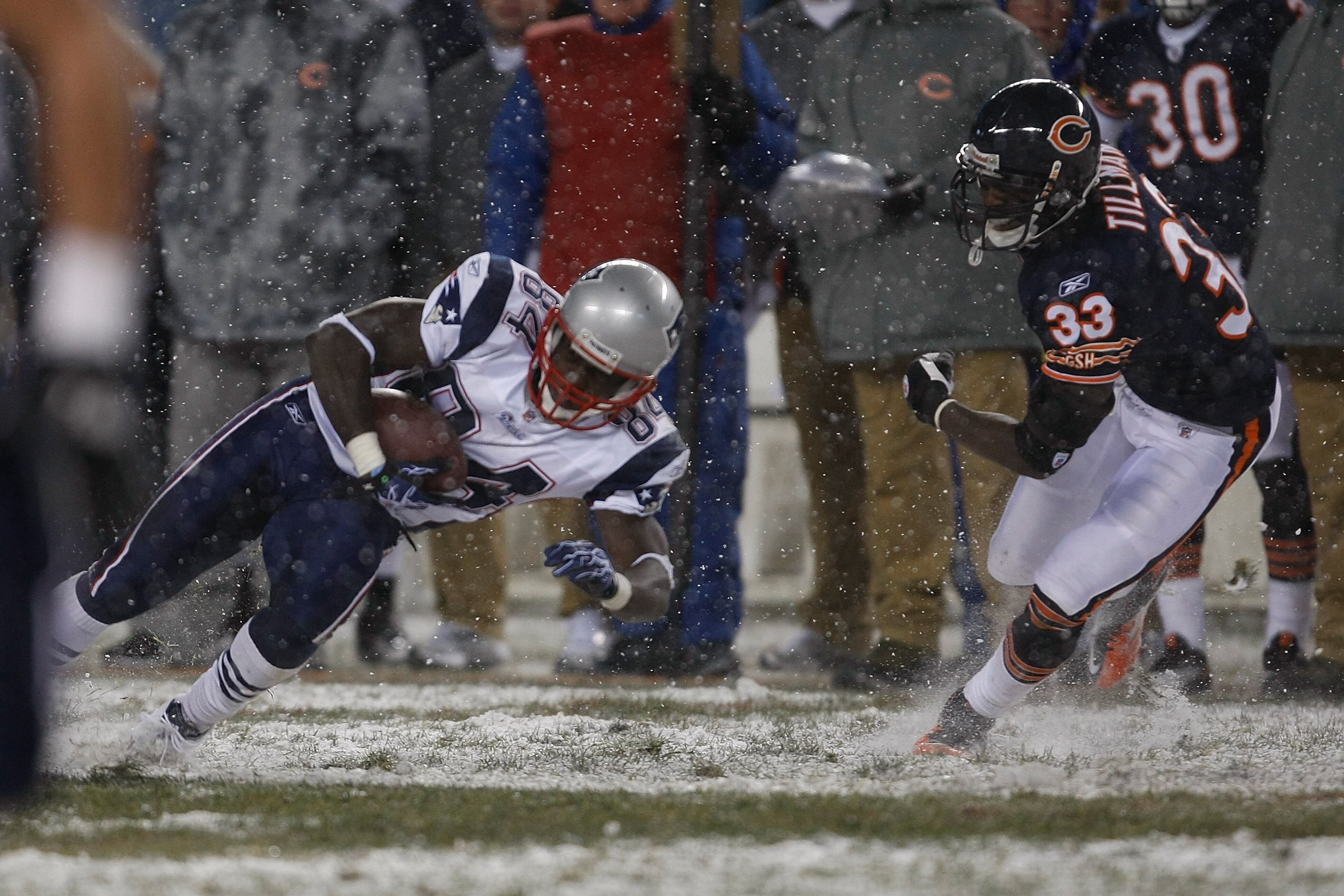 CHICAGO, IL - DECEMBER 12: Deion Branch #84 of the New England Patriots runs against the Chicago Bears at Soldier Field on December 12, 2010 in Chicago, Illinois. The Patriots defeated the Bears 36-7. (Photo by Scott Boehm/Getty Images)
