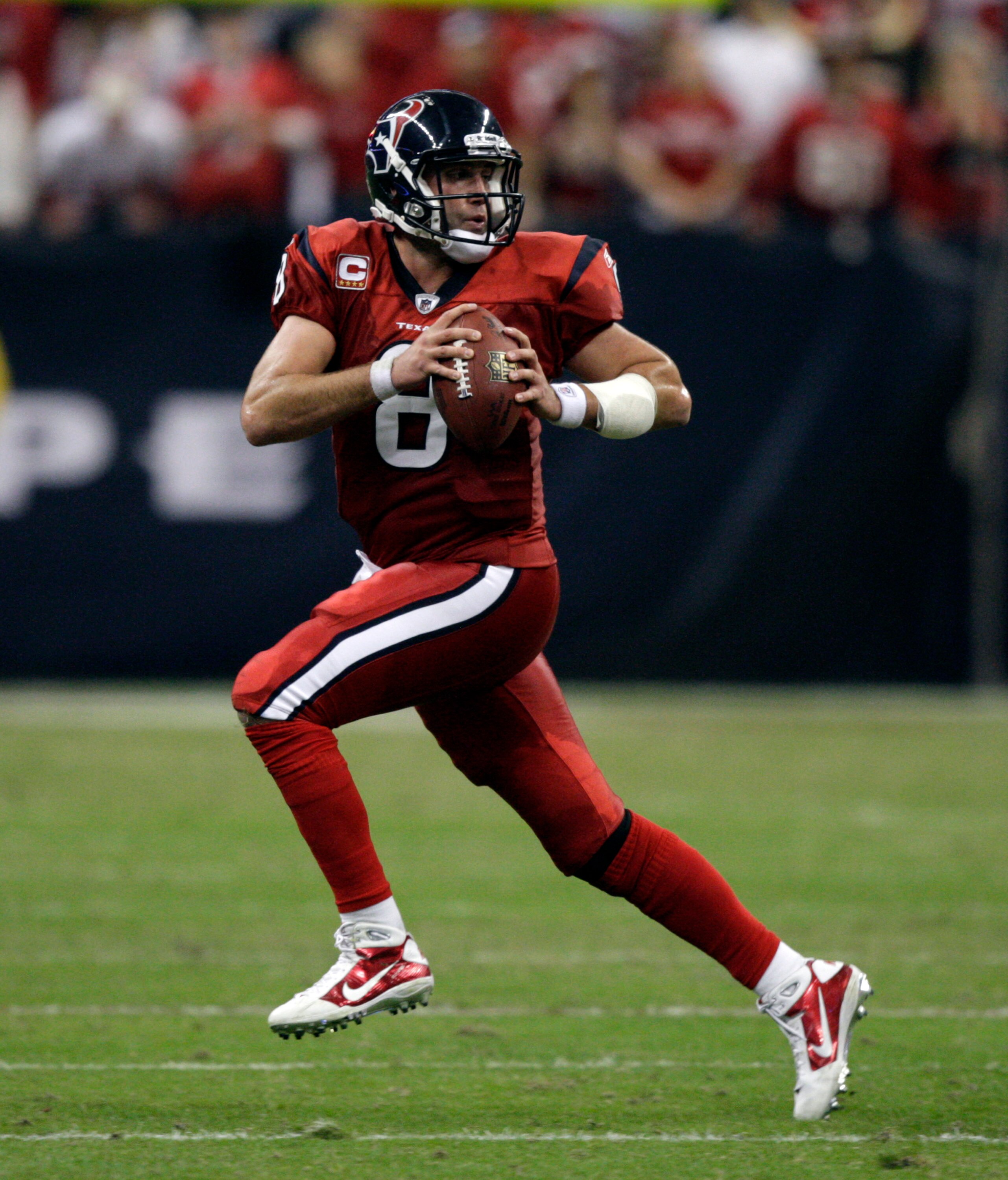 HOUSTON, TX - DECEMBER 13:  Quarterback Matt Schaub #8 of the Houston Texans runs out of the pocket as he looks for a receiver against the Baltimore Ravens at Reliant Stadium on December 13, 2010 in Houston, Texas.  (Photo by Bob Levey/Getty Images)