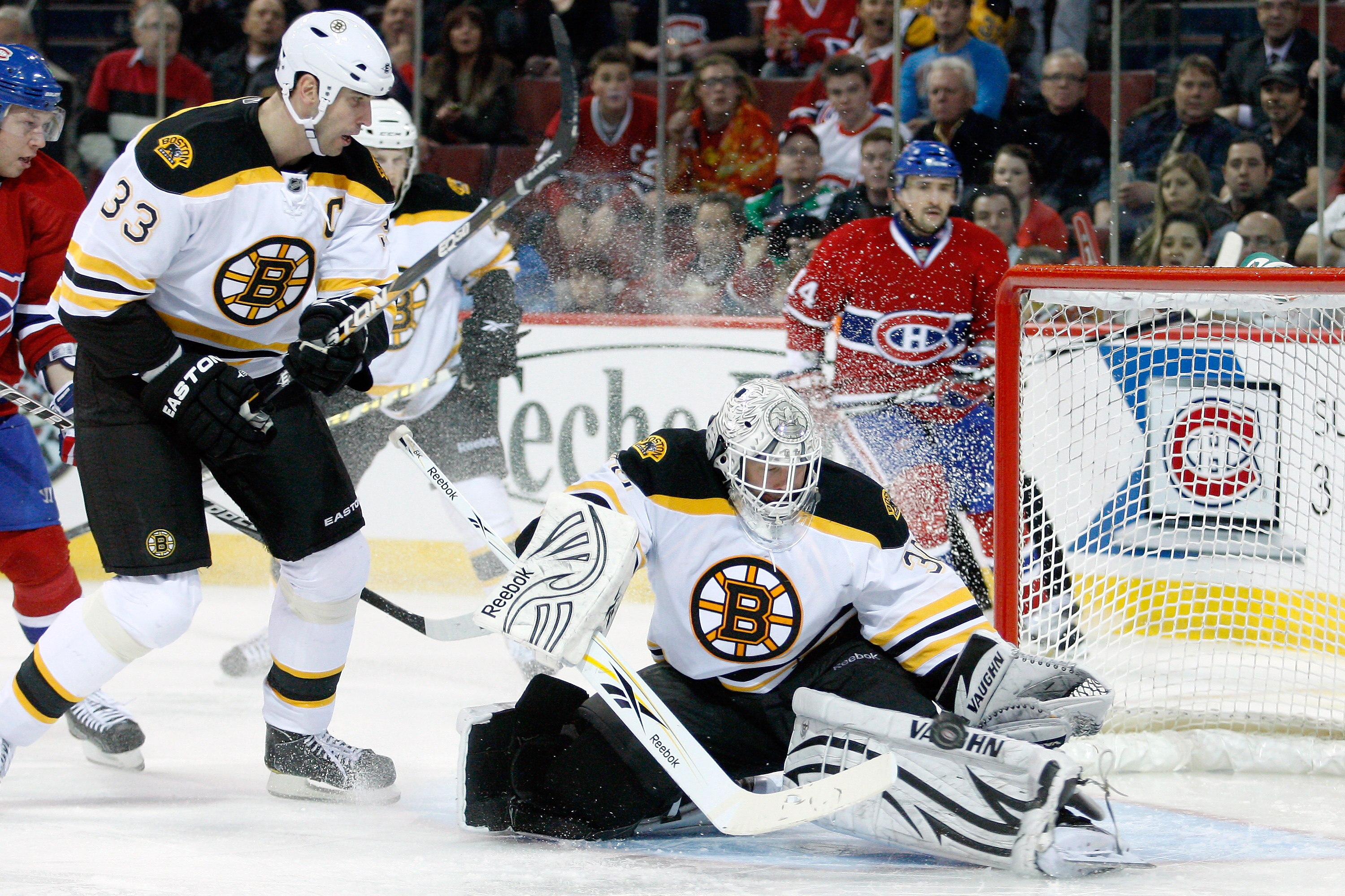 MONTREAL, CANADA - DECEMBER 16:  Tim Thomas #30 of the Boston Bruins makes a pad save on the puck during the NHL game against the Montreal Canadiens at the Bell Centre on December 16, 2010 in Montreal, Quebec, Canada.  (Photo by Richard Wolowicz/Getty Ima