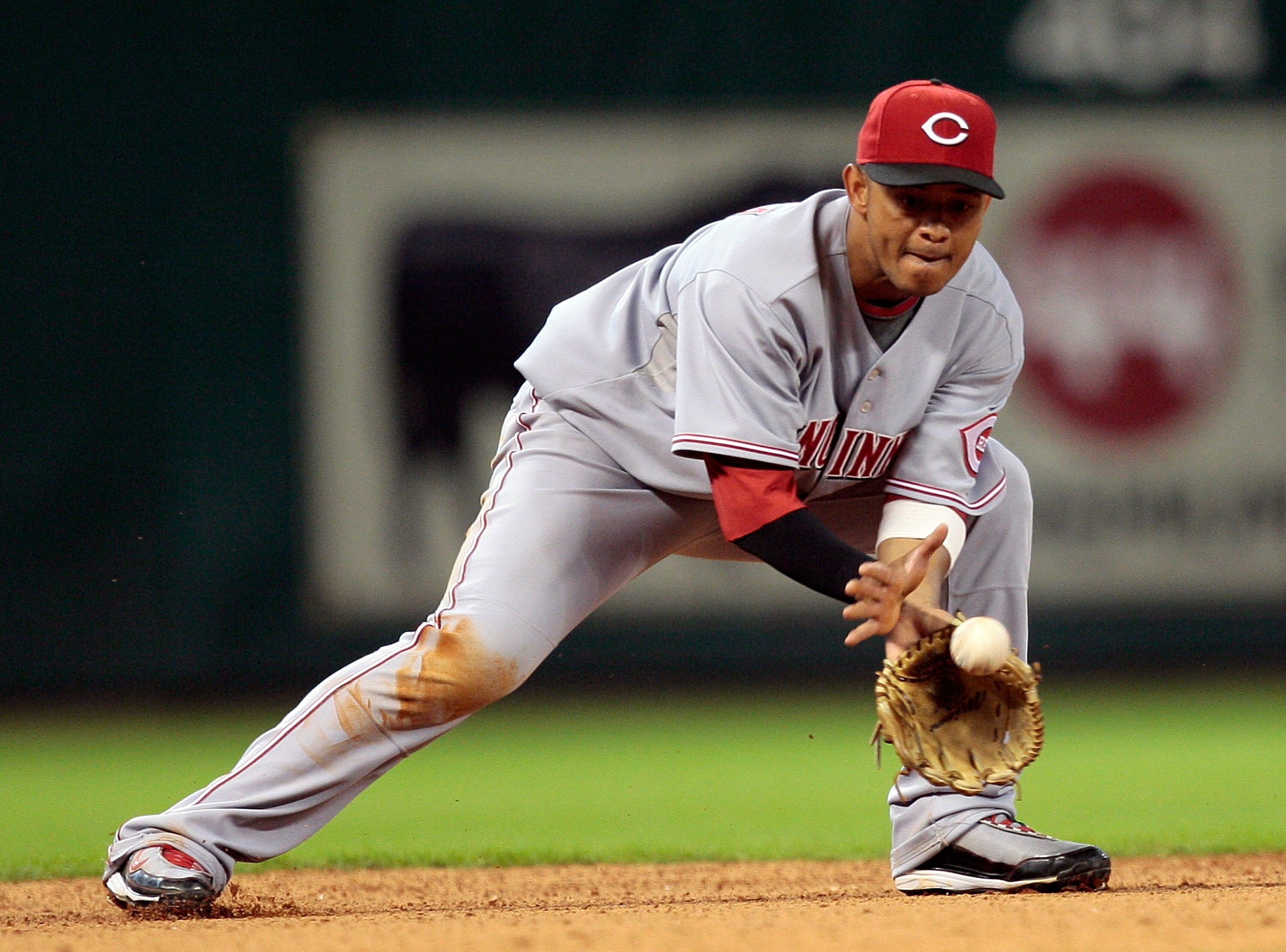 HOUSTON - JULY 24:  Shortstop Orlando Cabrera #2 of the Cincinnati Reds makes a play on a ball hit in the hole against the Houston Astros at Minute Maid Park on July 24, 2010 in Houston, Texas.  (Photo by Bob Levey/Getty Images)