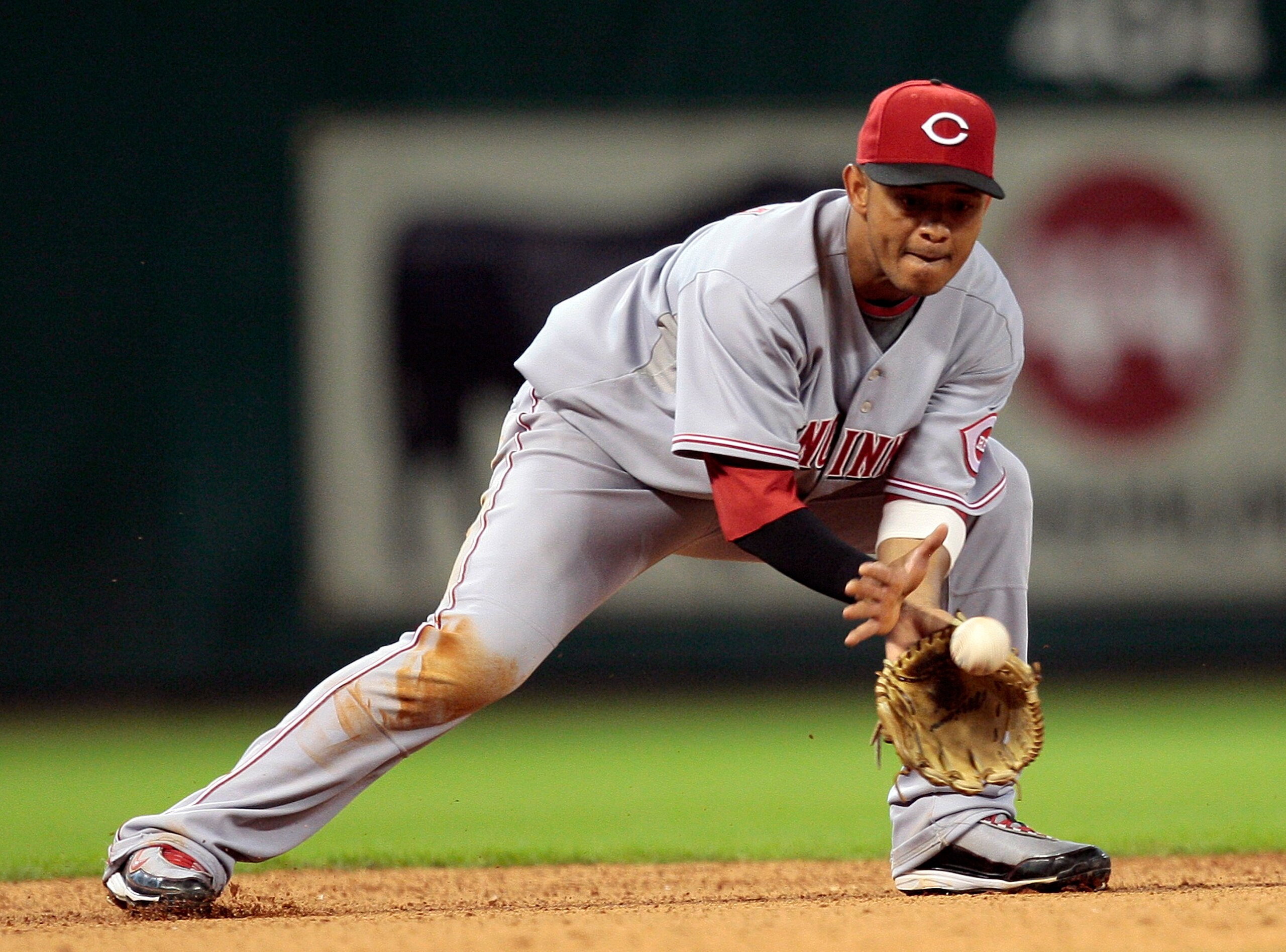 HOUSTON - JULY 24:  Shortstop Orlando Cabrera #2 of the Cincinnati Reds makes a play on a ball hit in the hole against the Houston Astros at Minute Maid Park on July 24, 2010 in Houston, Texas.  (Photo by Bob Levey/Getty Images)