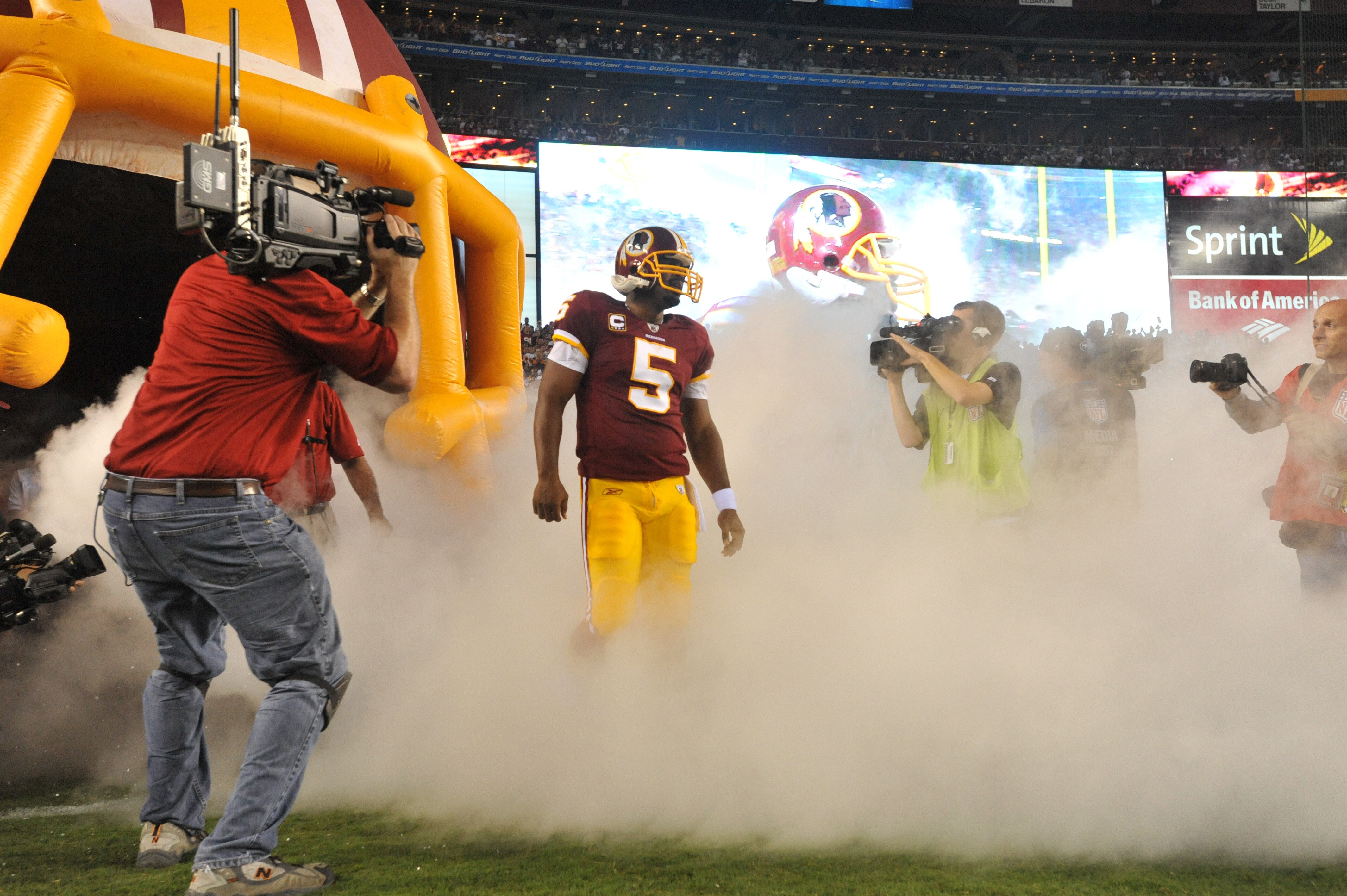 LANDOVER - SEPTEMBER 12:  Donovan McNabb #5 of the Washington Redskins prepares to run onto the field before the NFL season opener against the Dallas Cowboys at FedExField on September 12, 2010 in Landover, Maryland. The Redskins defeated the Cowboys 13-7