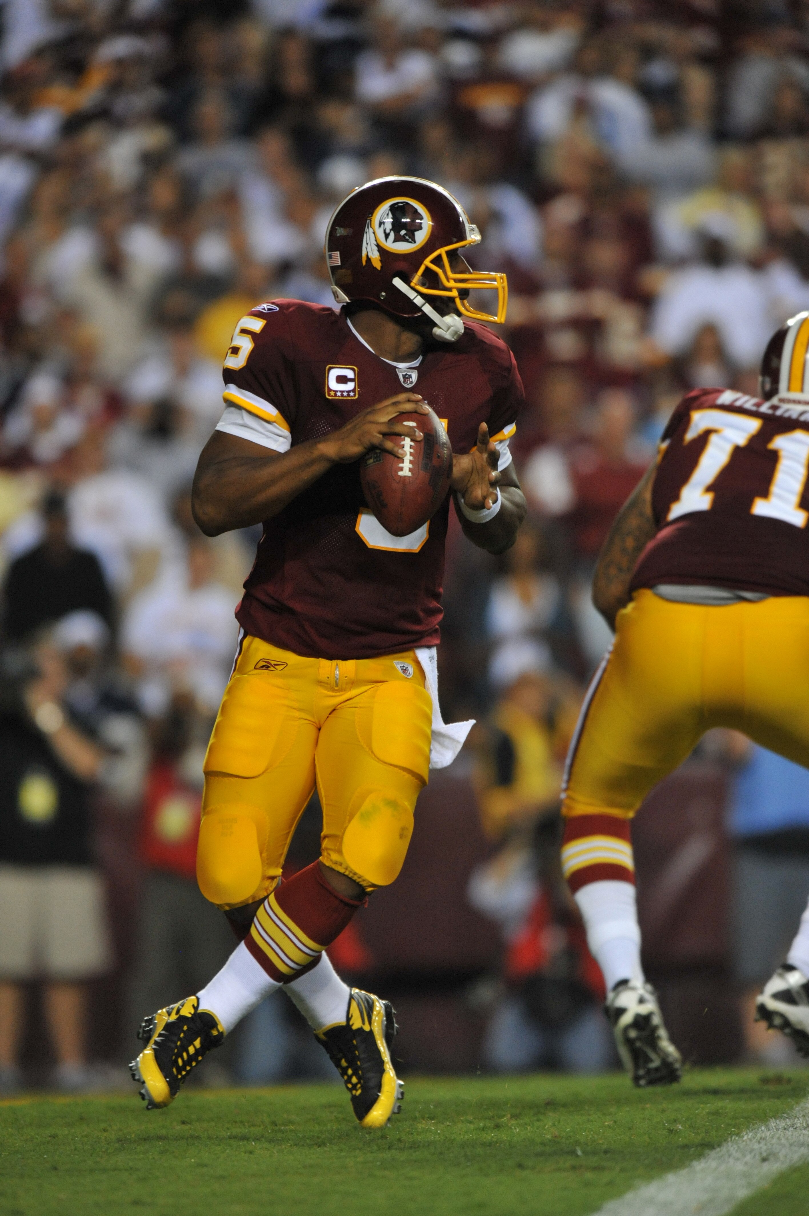 LANDOVER - SEPTEMBER 12:  Donovan McNabb #5 of the Washington Redskins passes during the NFL season opener against the Dallas Cowboys at FedExField on September 12, 2010 in Landover, Maryland. The Redskins defeated the Cowboys 13-7. (Photo by Larry French